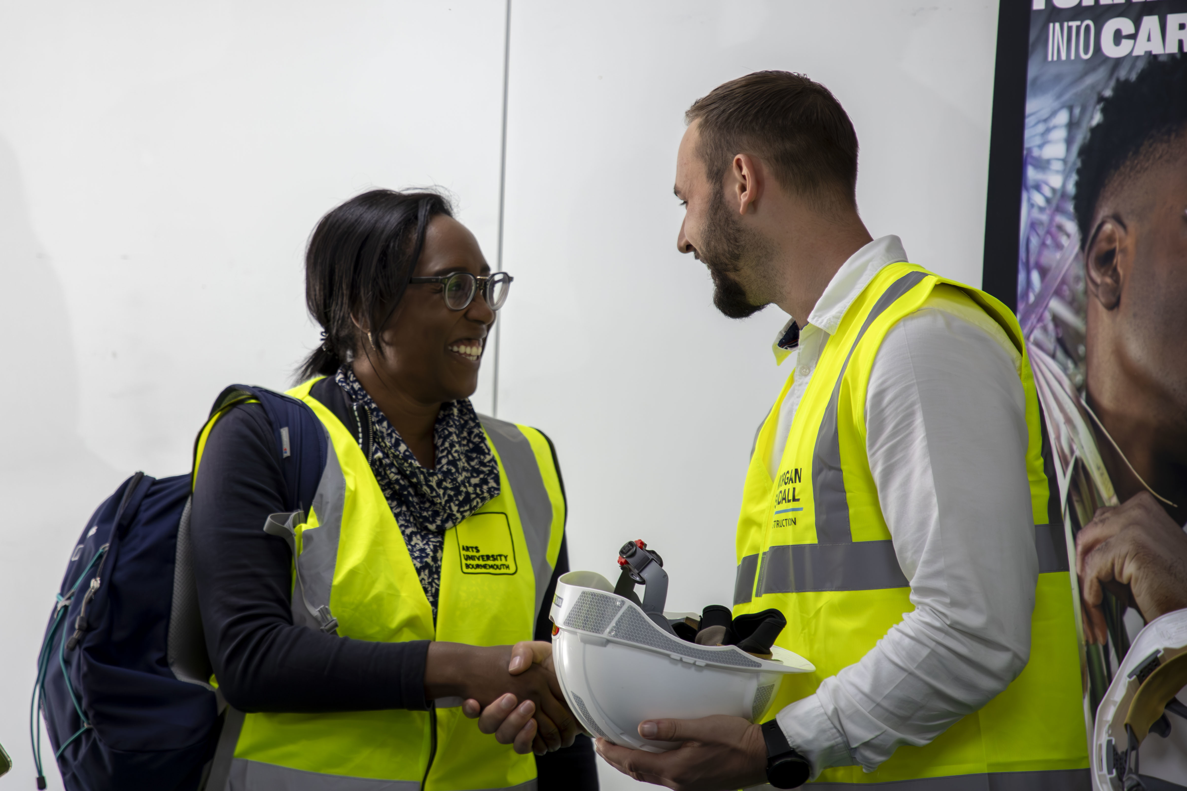 M Frederick shaking hands with a member of Morgan Sindall staff at AUB's Air Source Heat Pump opening ceremony.