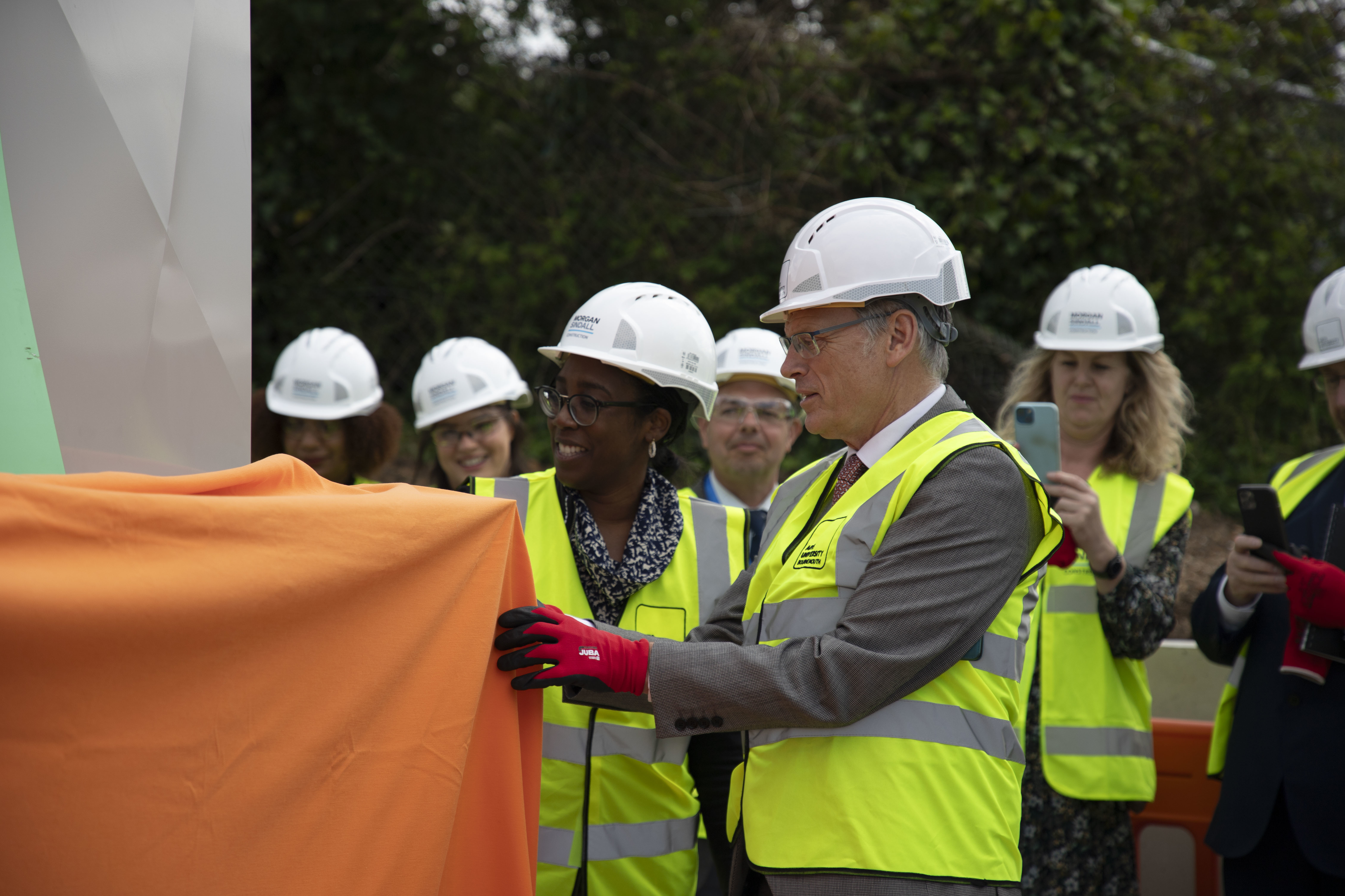 Professor P Gough and M Frederick at the Air Source Heat Pump installation ceremony on AUB campus.