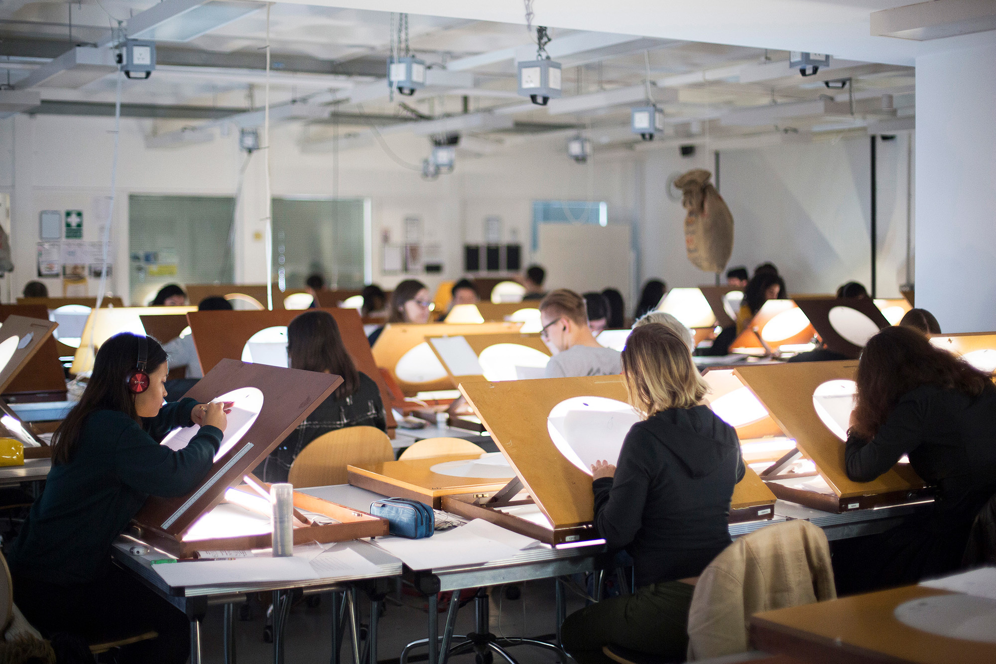 Students at AUB in the Animation studios – they're practising illustration skills using a light box