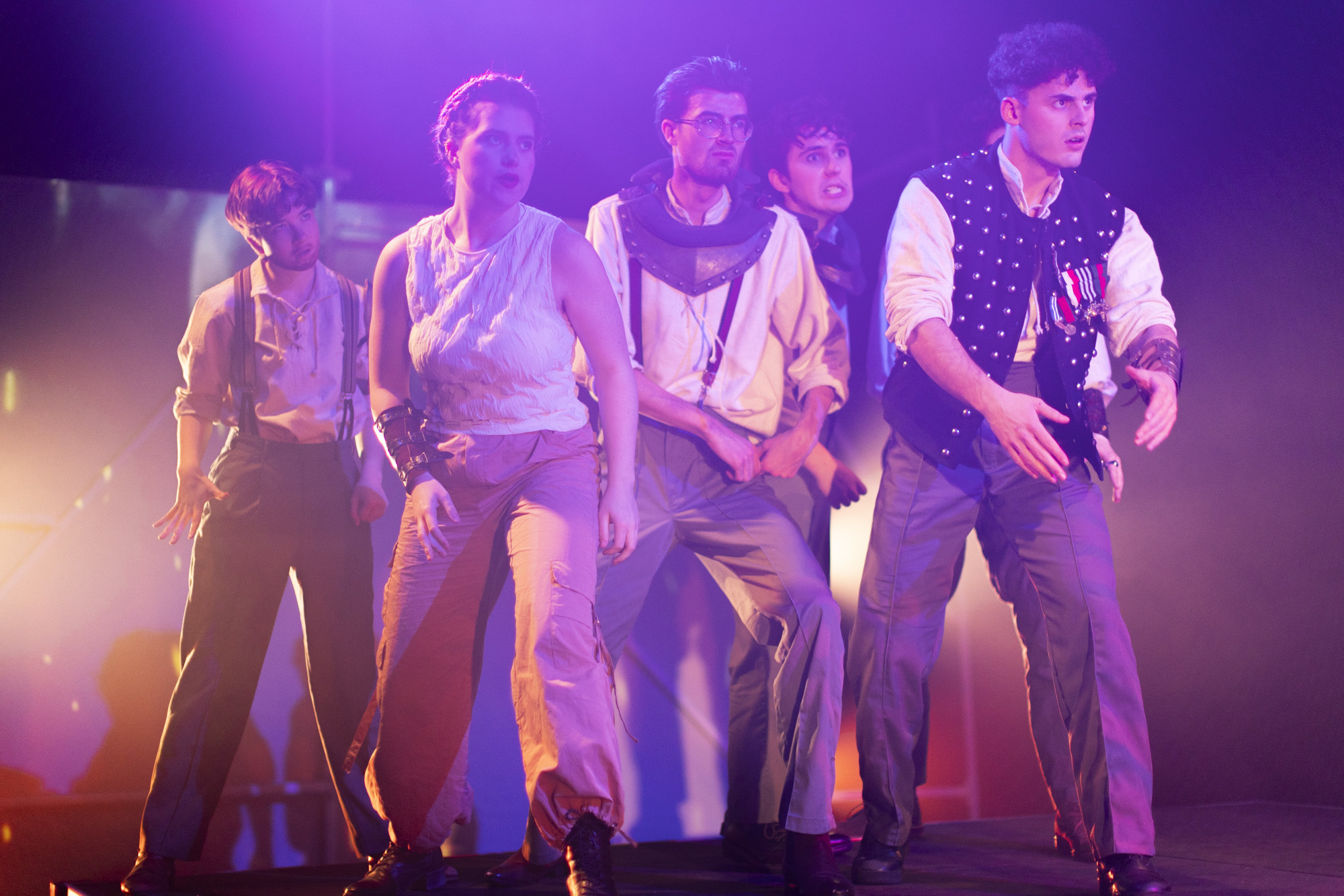 Five BA (Hons) Acting students standing on a smokey stage in costume while performing "I, Joan".