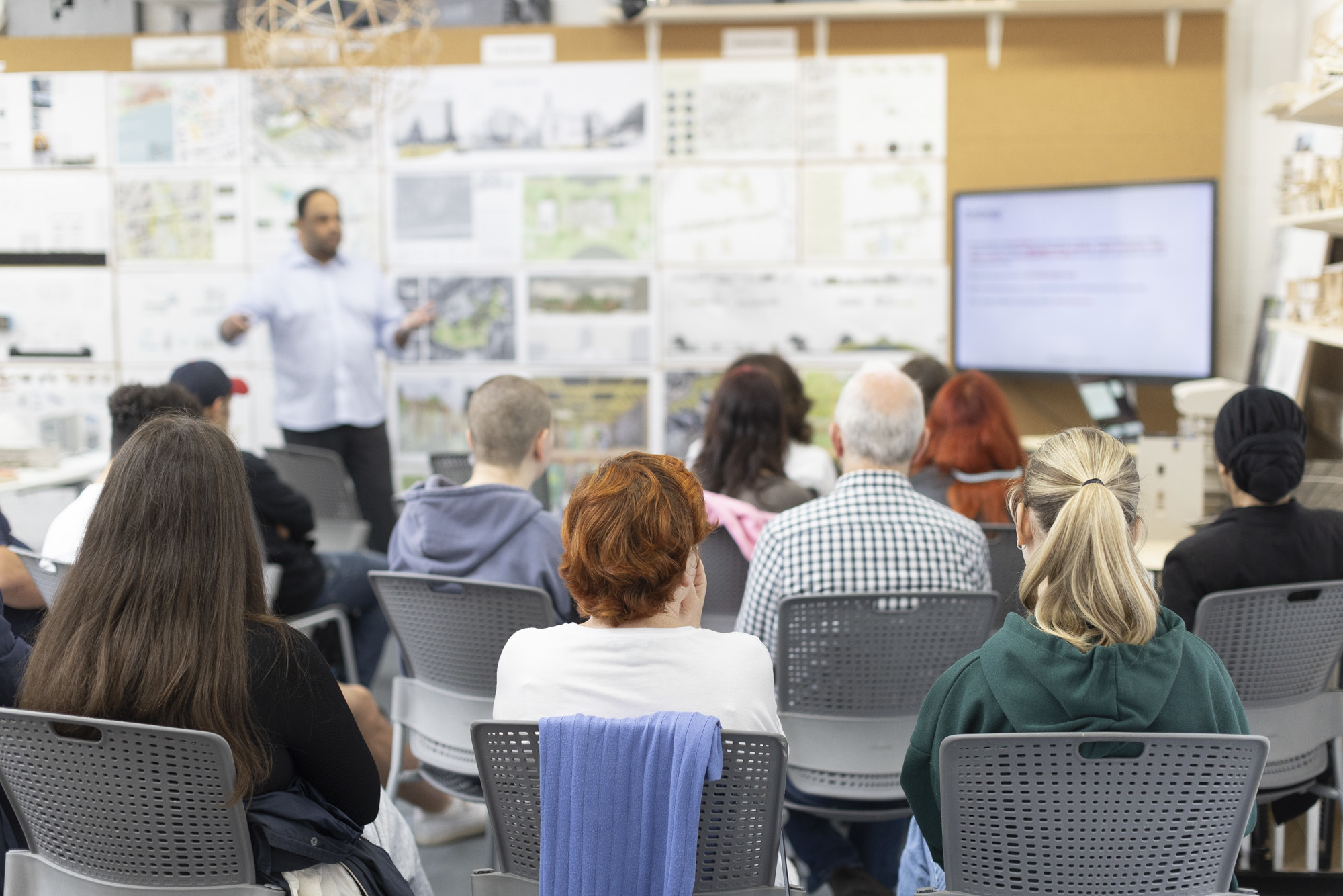 Prospective students listening to a talk from BA (Hons) Architecture lecturer at an on-campus open day