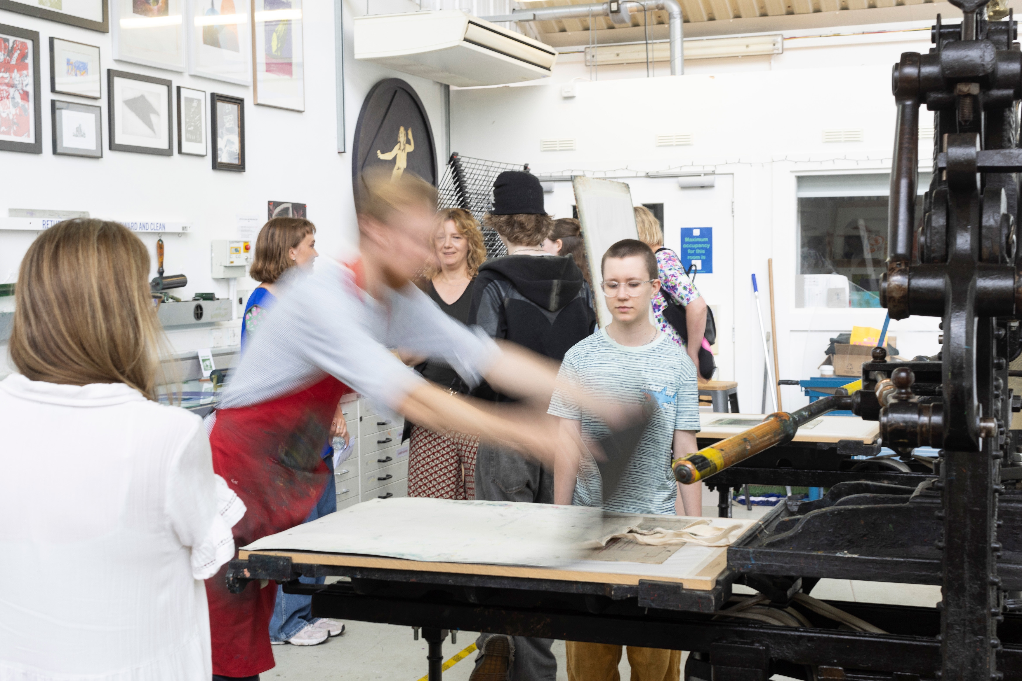 Prospective students and their guests taking part in the complimentary print workshop on an Open Day. The workshop is run by artists and AUB Alumni Robin Mackenzie and Katy Harrald