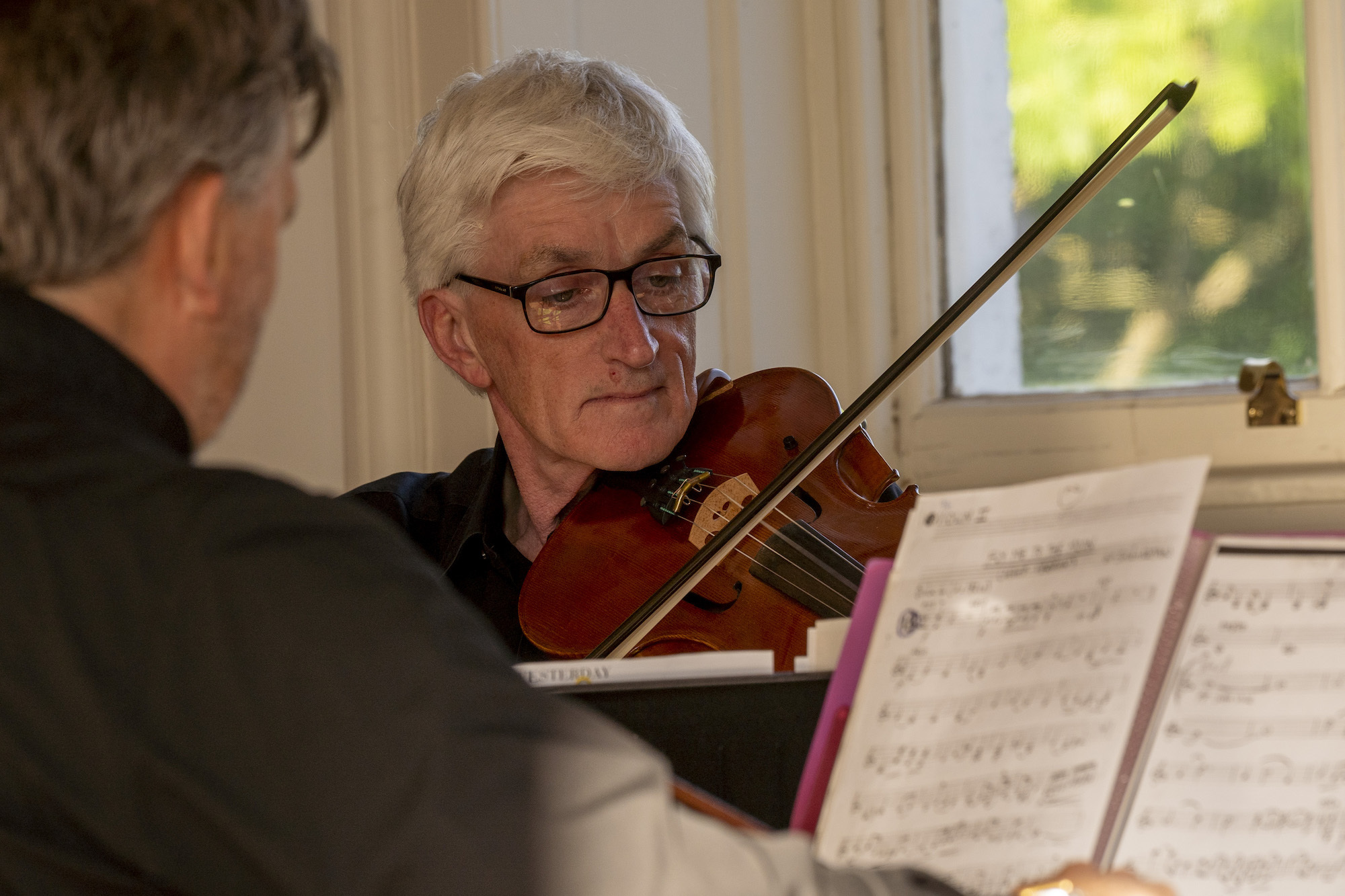 Man with Violine performing at the AUB Dance Guildhall Opera Purcell Dido and Aeneas
