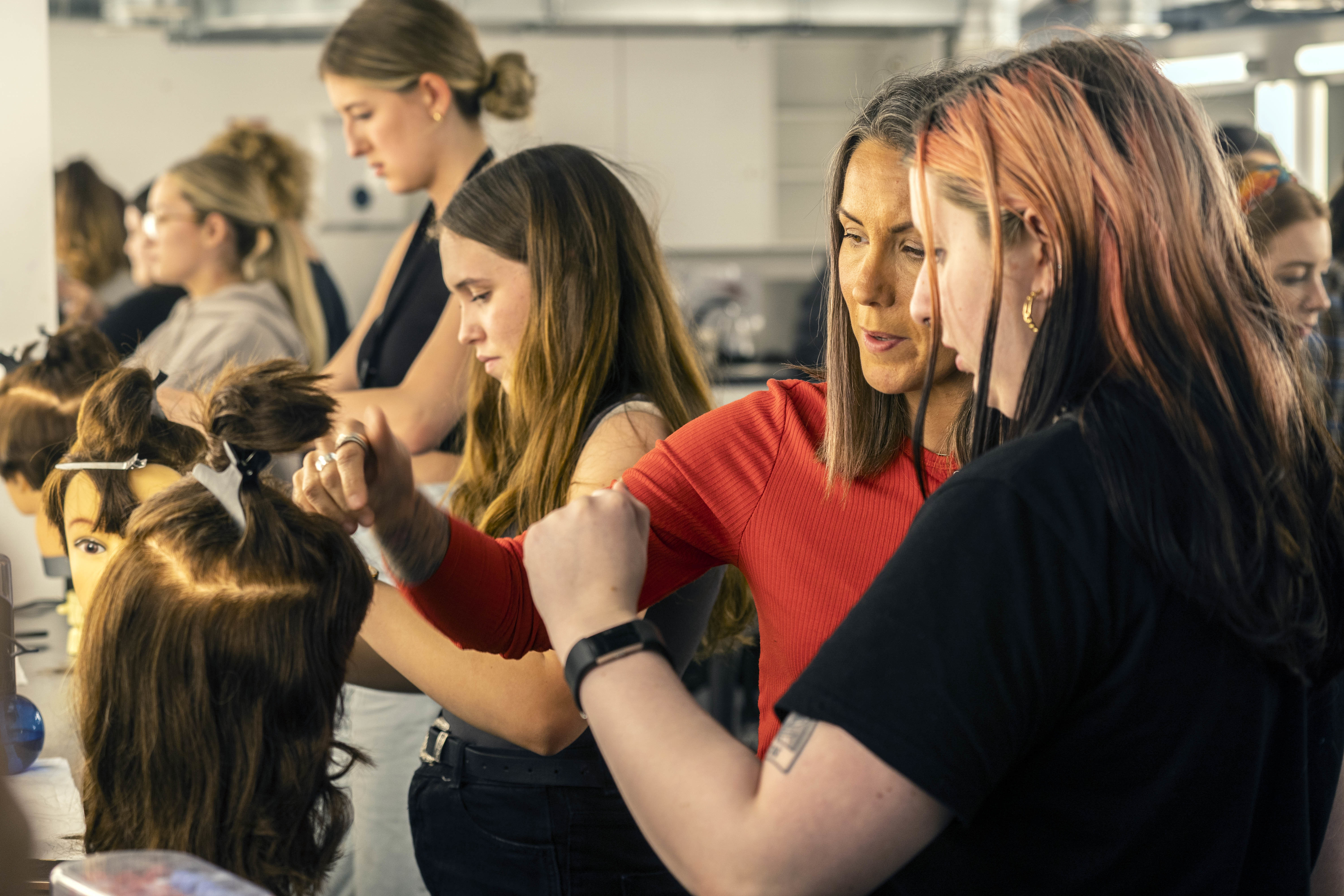 Students work on hairdressing skills