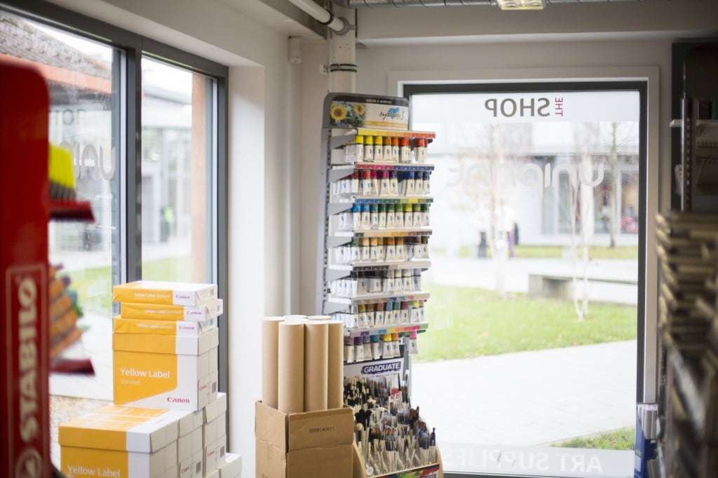 Uniprint shop based on AUB's campus – paints and paper lining the walls
