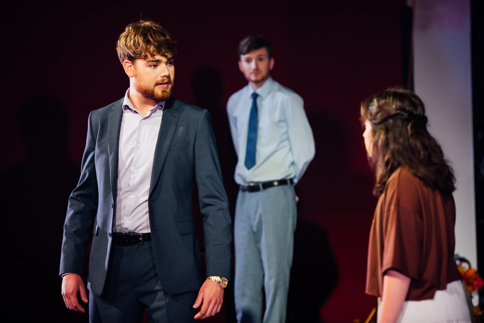 Actors on stage in A Midsummer Night's Dream, formal costumes.