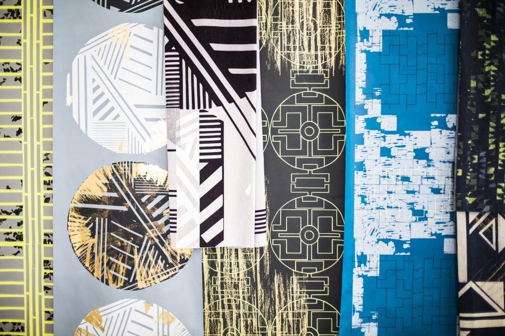 Different coloured and patterned materials on top of each other