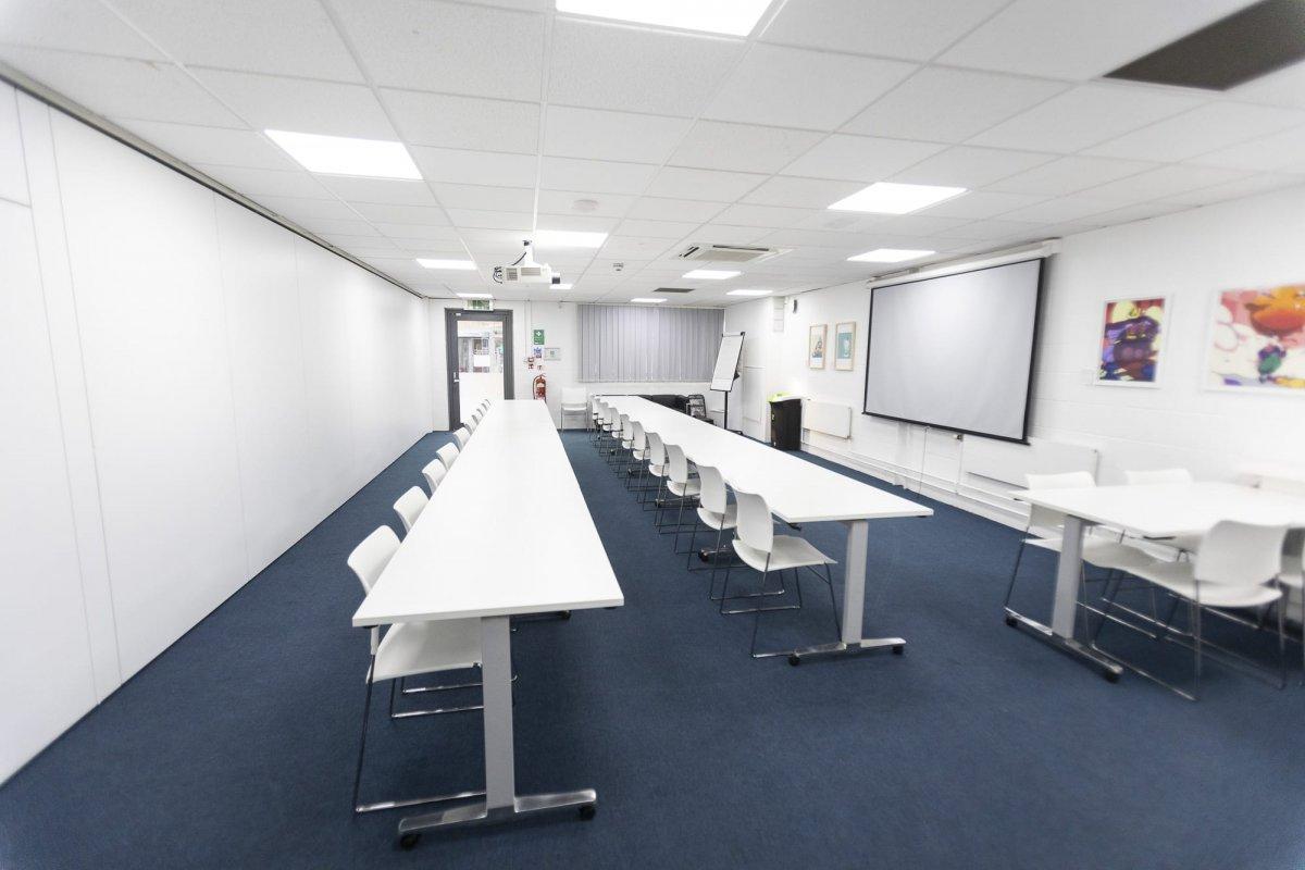 Inside the Conference Centre featuring long tables and chairs