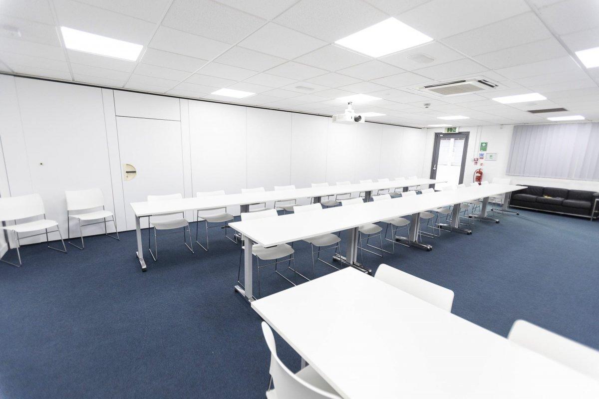 Inside the Conference Centre featuring long tables and chairs