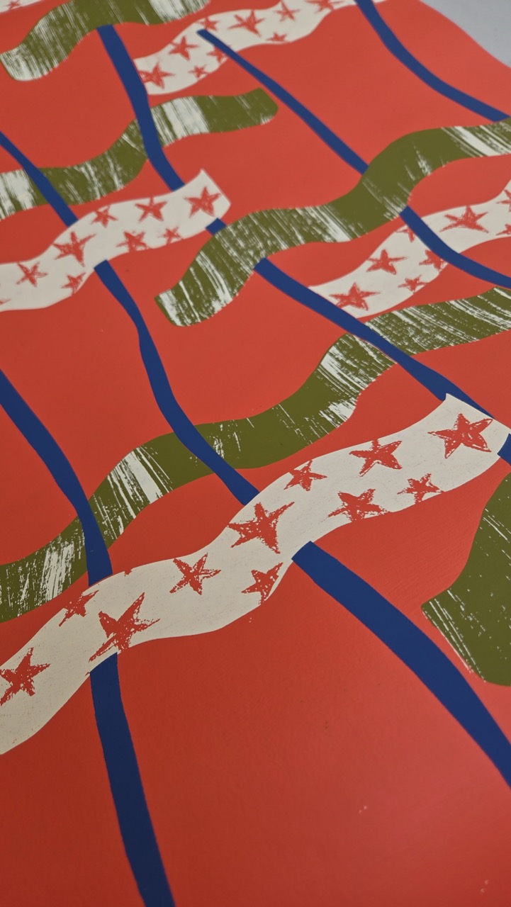 A vibrant red background featuring layered abstract patterns in green and blue. White ribbons with red stars are interspersed among wavy green lines, creating a dynamic and colourful composition.