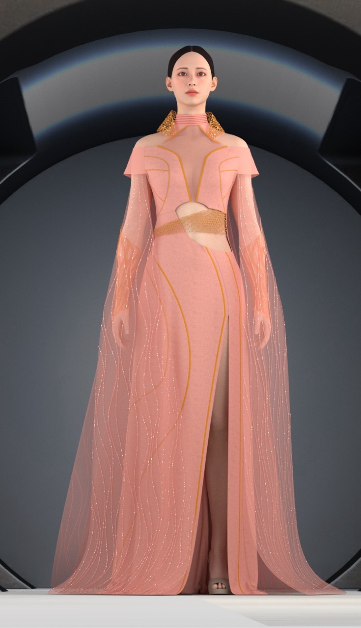 Woman in flowing pink gown with gold collar detail stands within curved grey archway. Dress features cut-out waist and long cape sleeves.