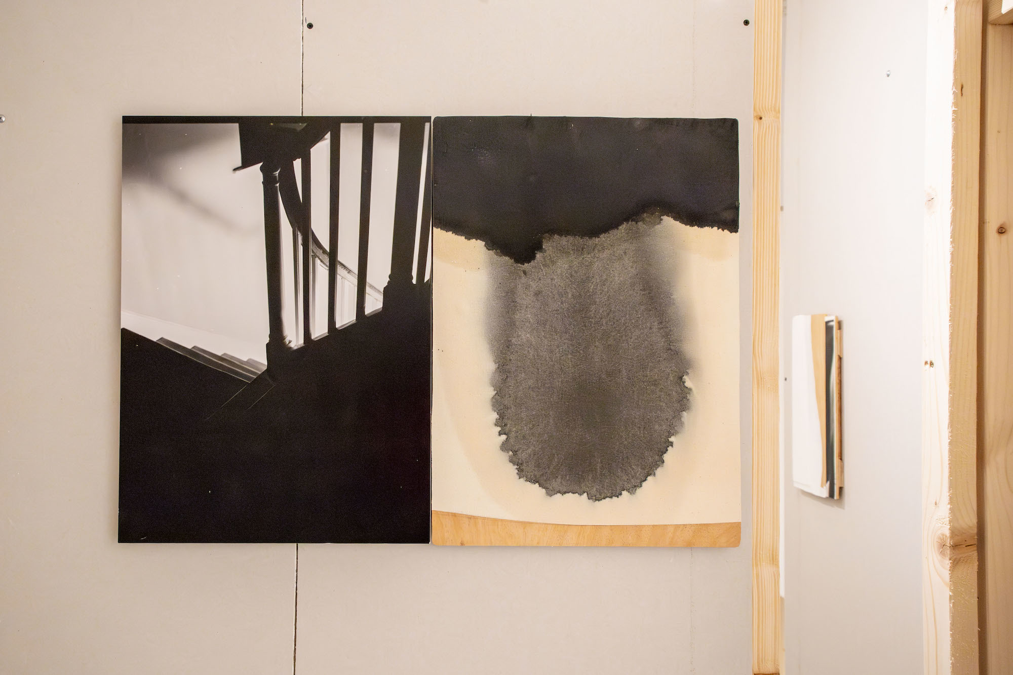 Two abstract pieces of artwork on canvases displayed in TheGallery at AUB.