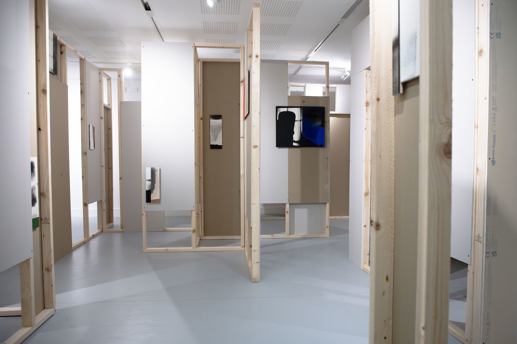 Ian McKeever's abstract gallery, with wooden walls and painted artwork displayed in TheGallery at AUB.