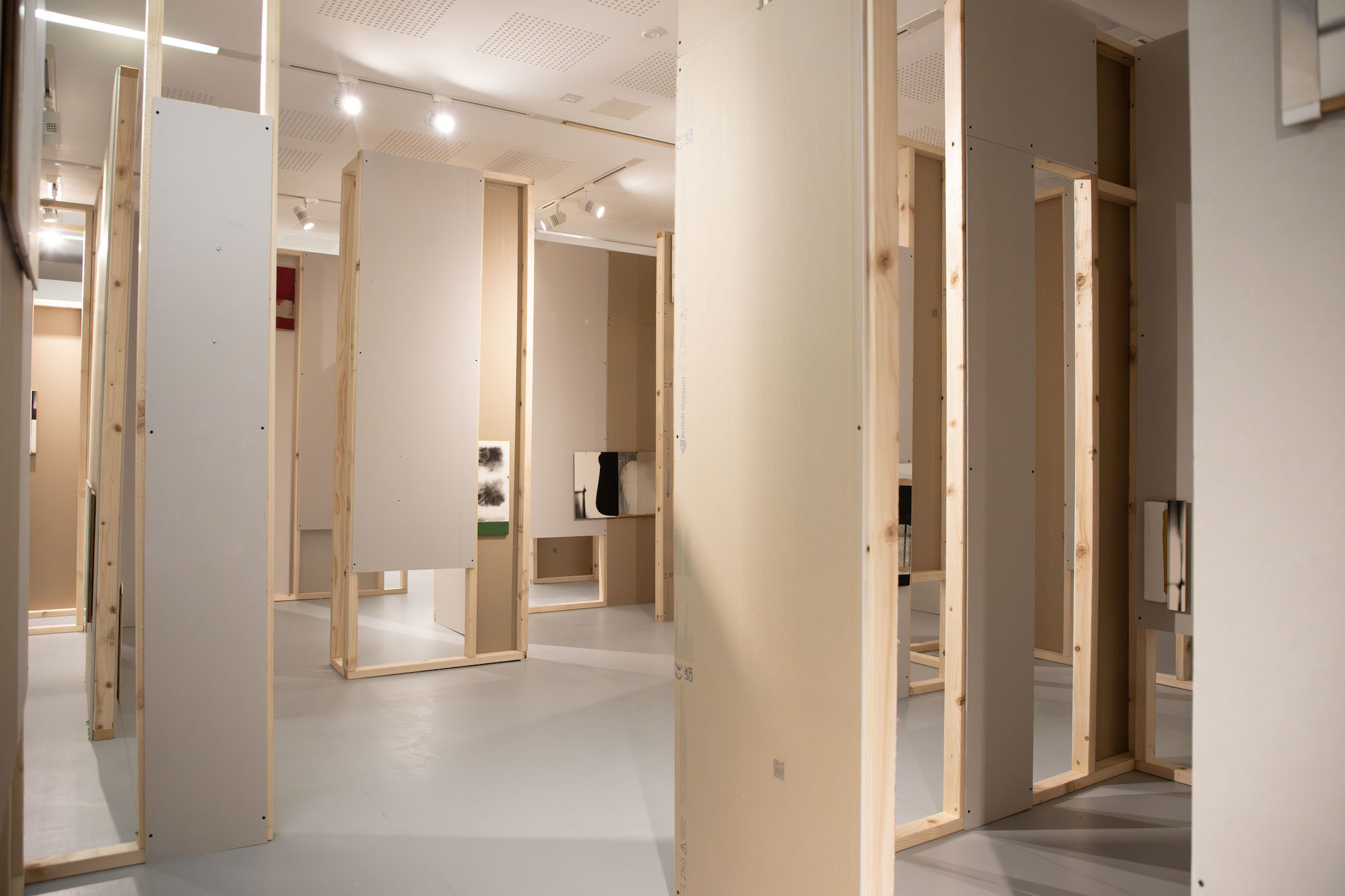 Ian McKeever's abstract gallery, with wooden walls and painted artwork displayed in TheGallery at AUB.