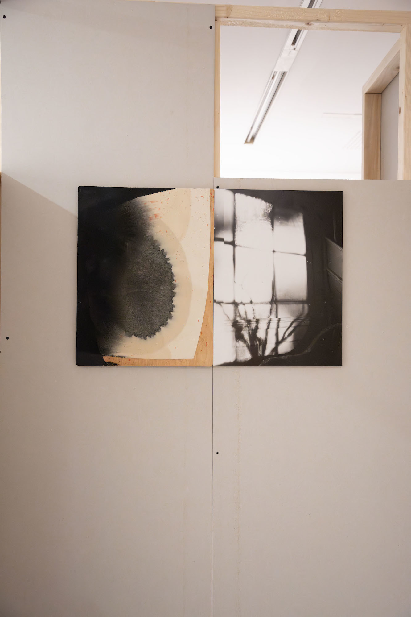 Two abstract pieces of artwork on canvases displayed in TheGallery at AUB.