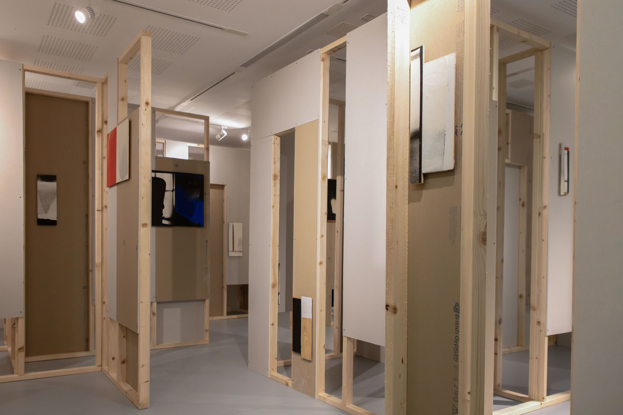 Ian McKeever's abstract gallery, with wooden walls and painted artwork displayed in TheGallery at AUB.