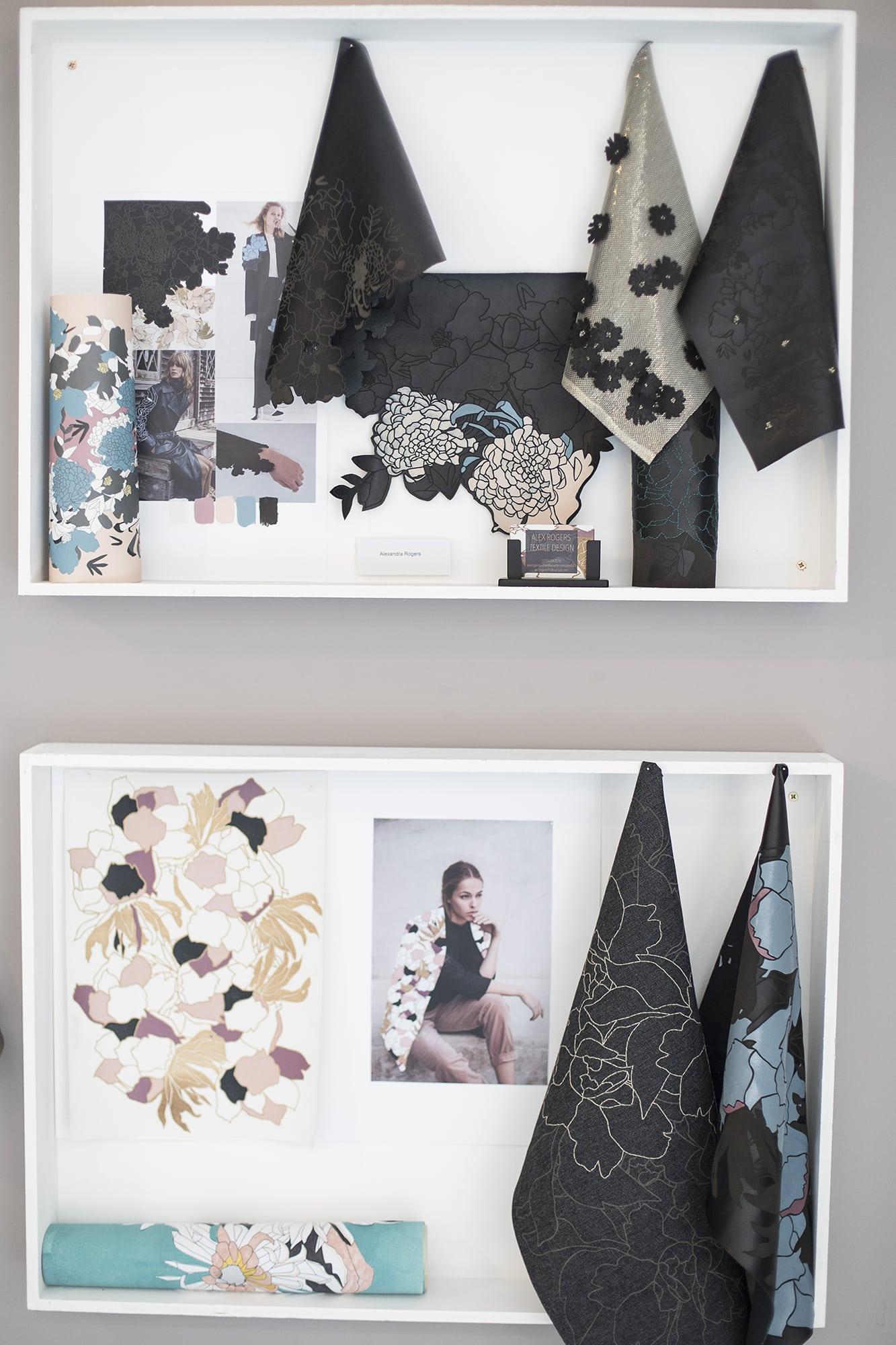 Two display boxes containing photos and fabric samples.
