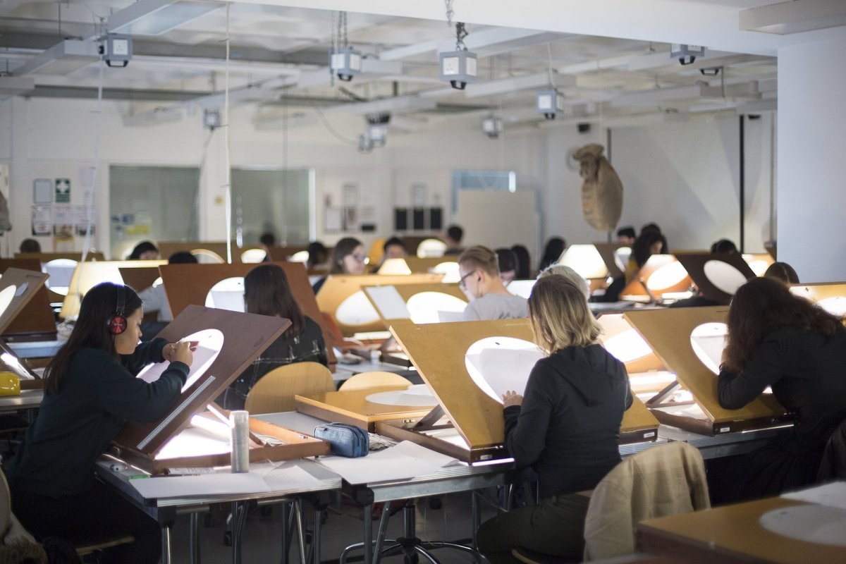 Students using lightboxes in an Animation Studio
