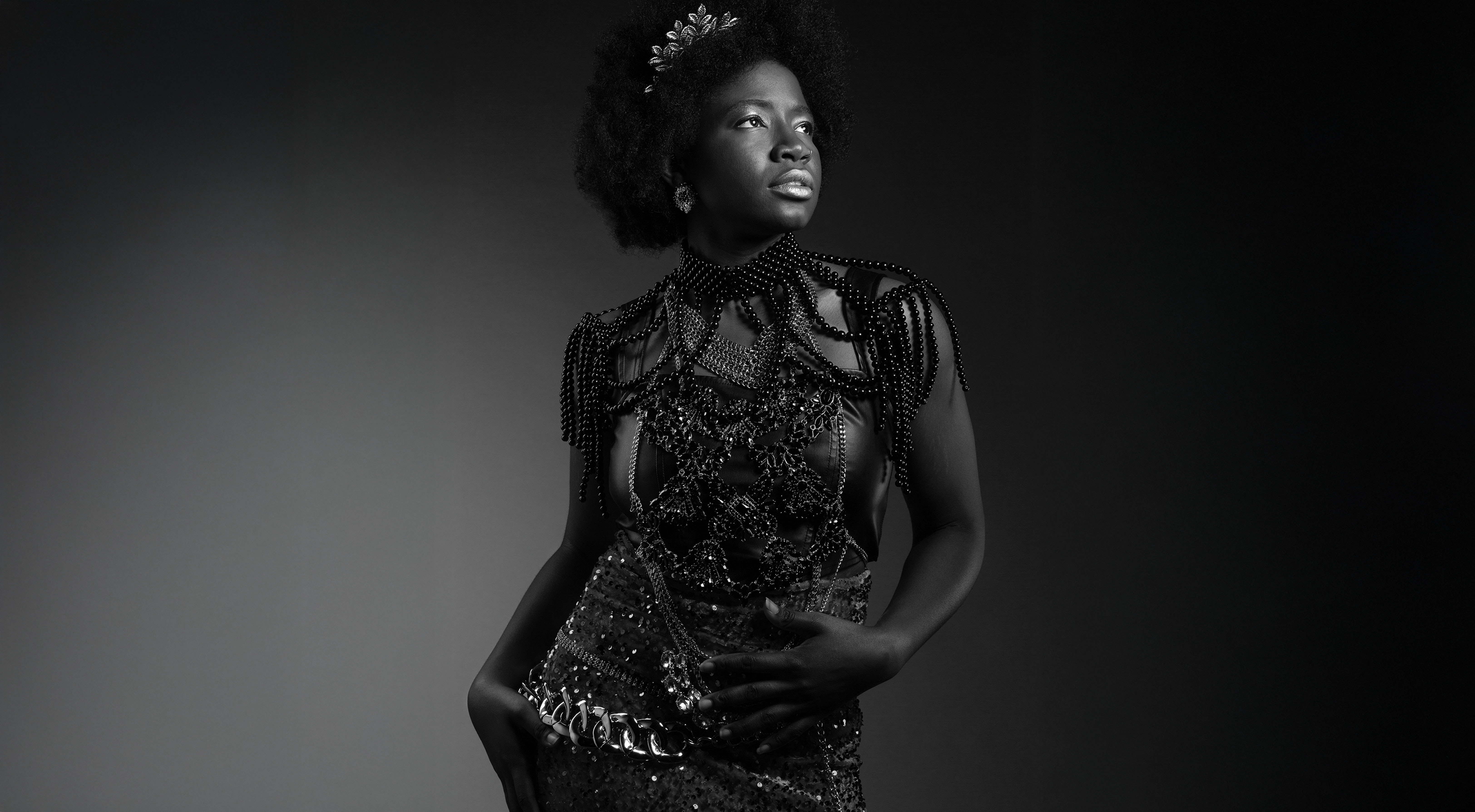 Black and white image of a model looking to the right hand side