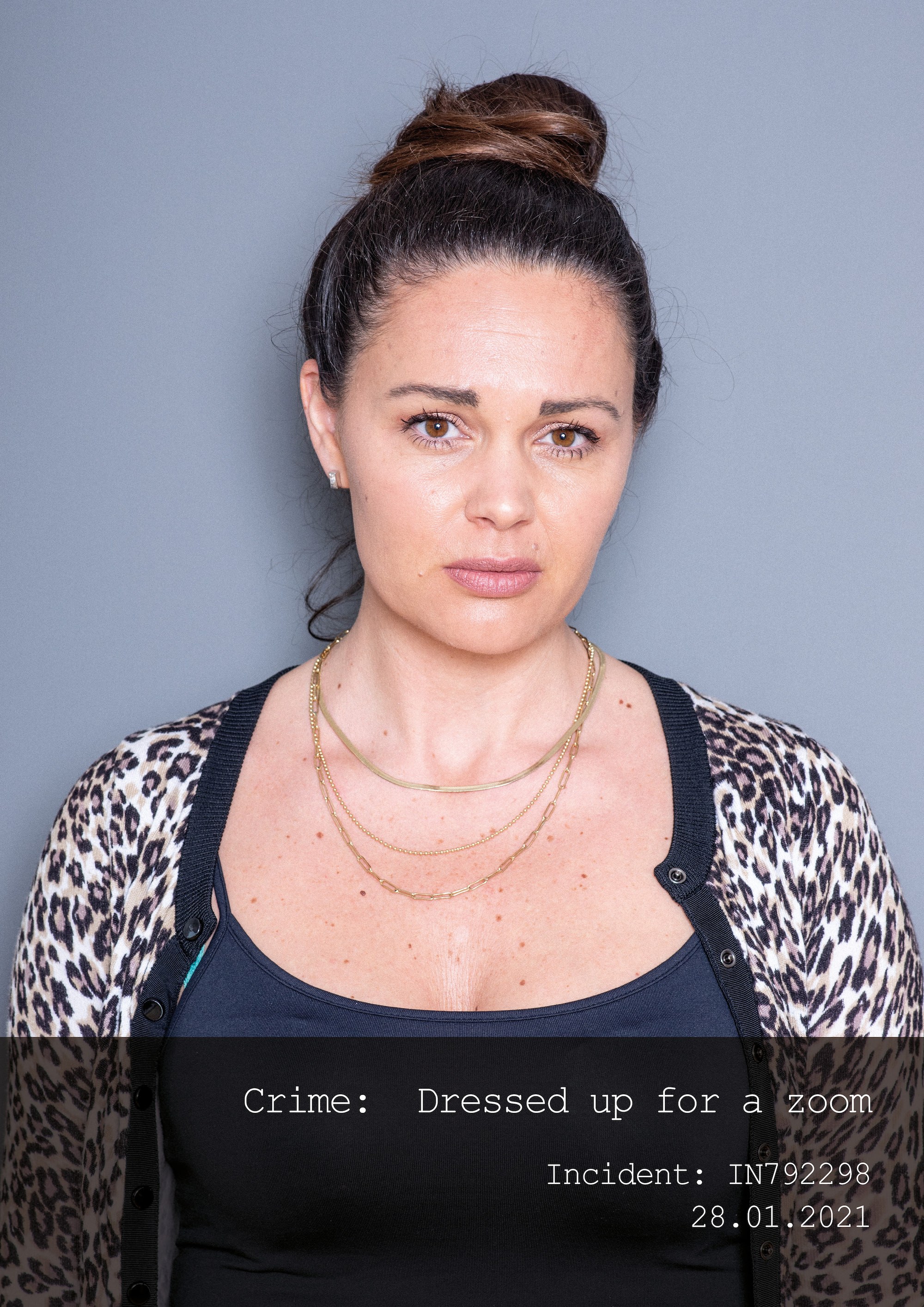 Mugshot of a woman with a text of her "crime"