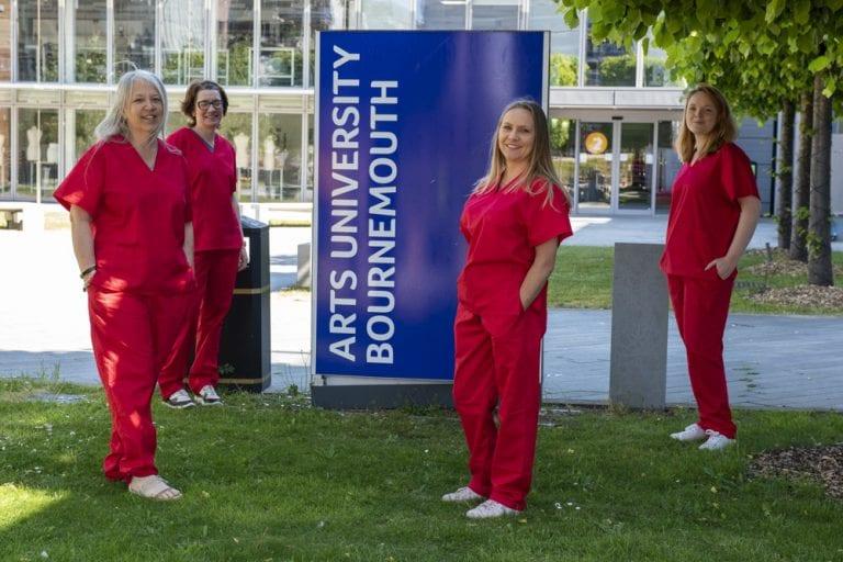 Nurses in red scrubs