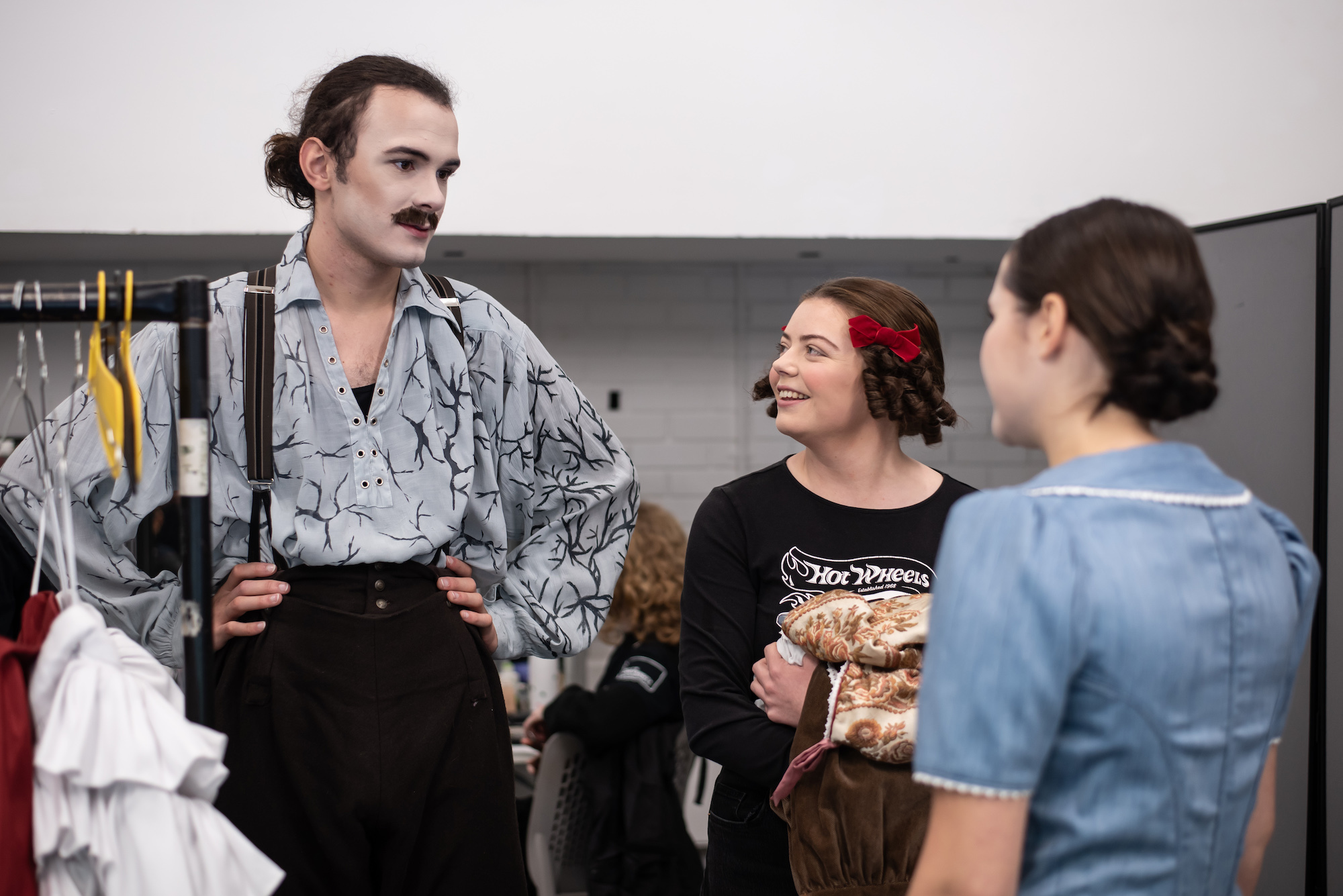 Three members of the cast and crew on "The Wolves of Willoughby Chase", talking backstage.