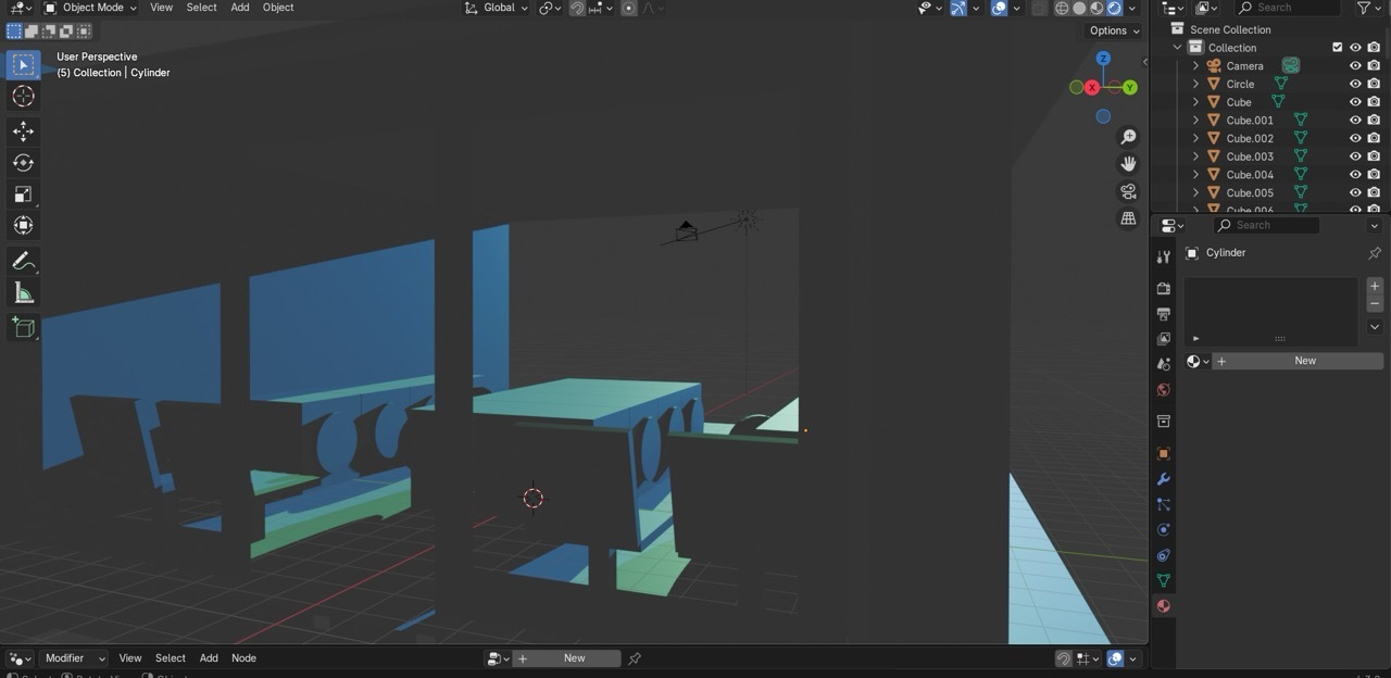 3D modelling software interface showing blue and teal geometric shapes including rectangular blocks and angular forms against dark grey background.