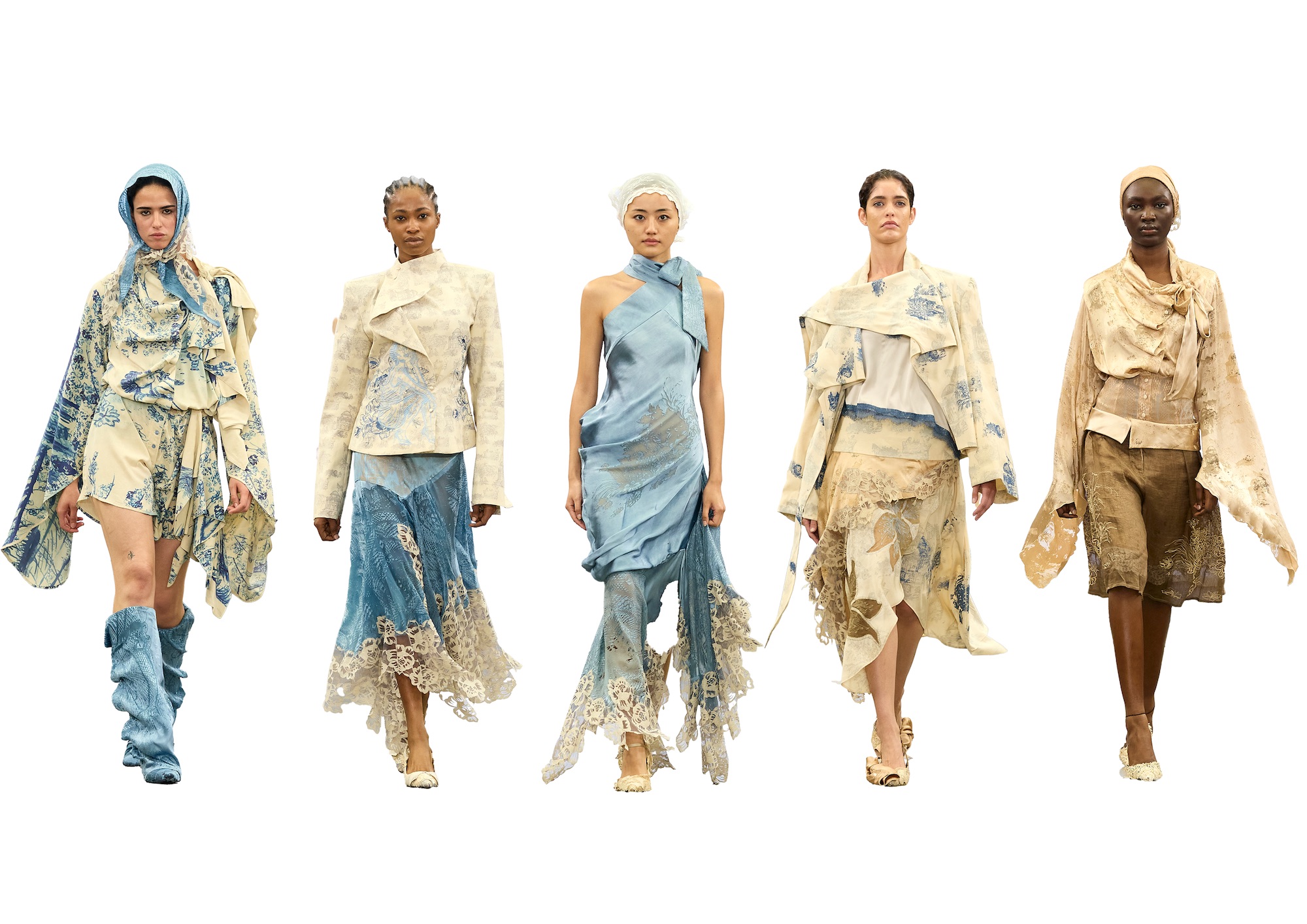 Five models showcasing avant-garde fashion on a runway. Each wears unique designs featuring shades of blue and beige, incorporating various textures and patterns, along with asymmetrical cuts and layered elements.