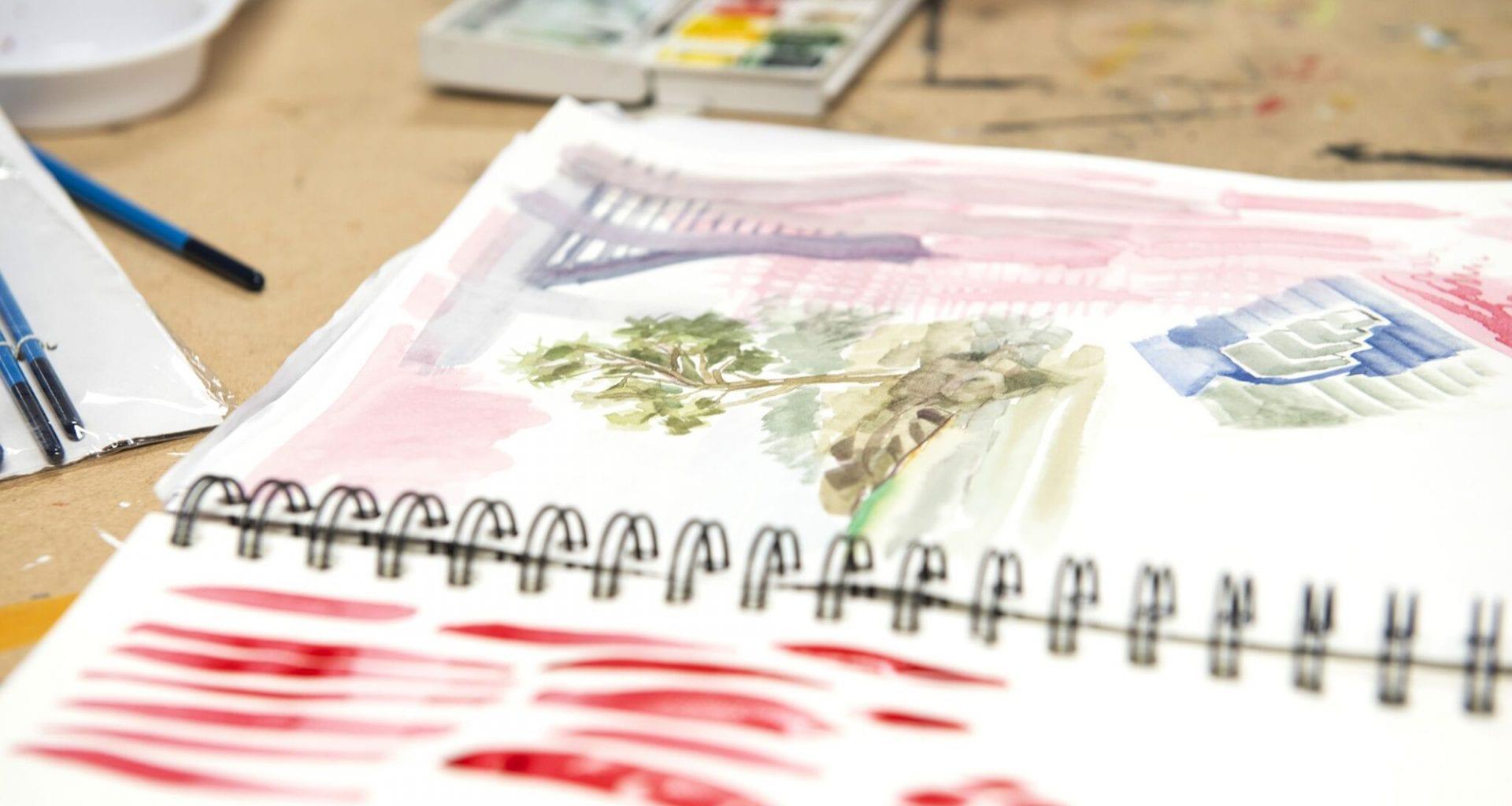 Watercolour paintings in a sketchbook
