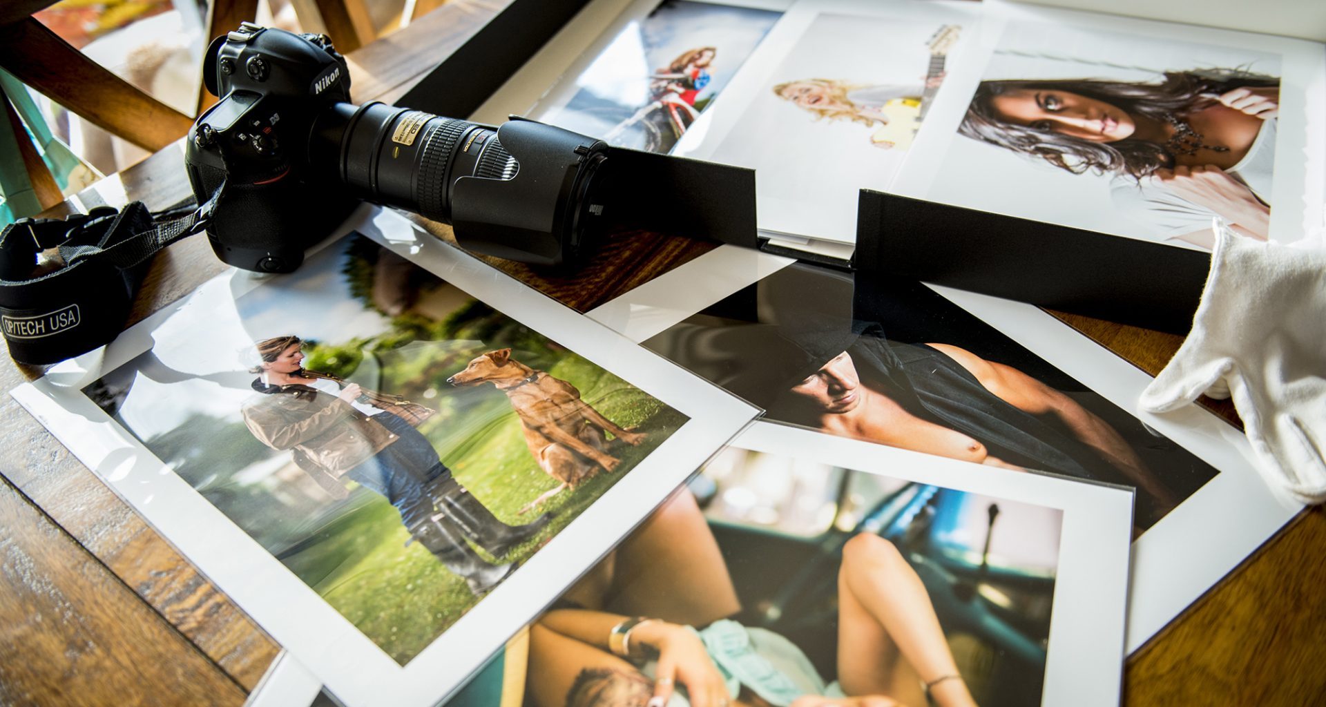 Photographs strewn out on a table