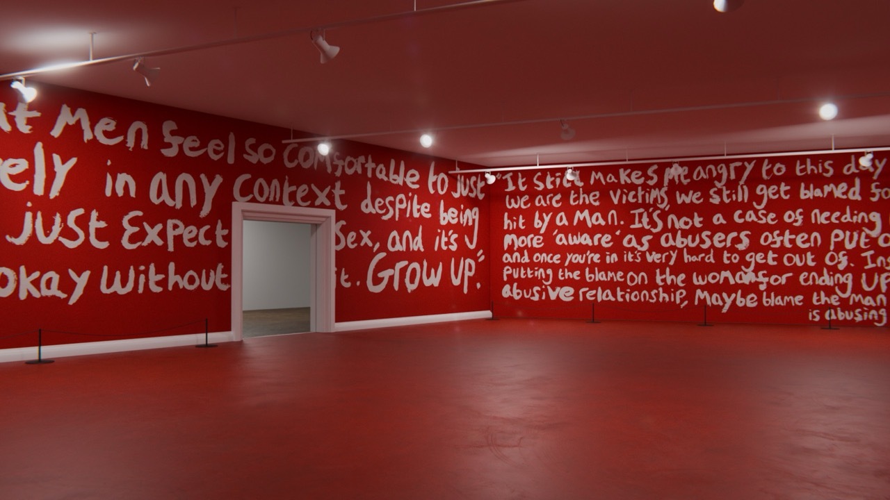 Large, red room with large white handwritten text on the walls, quotes relating to feminism and victim blaming.