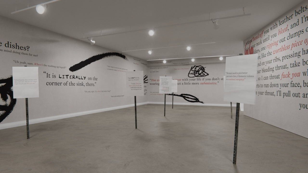 White room with display stands and black/red text written on the walls, relating to feminism with quotes from female voices.