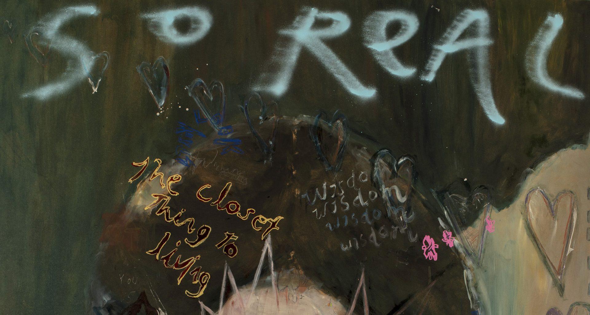 Close-up of an oil painting with words reading "So real" and "the closest thing to living" graffitied on it.