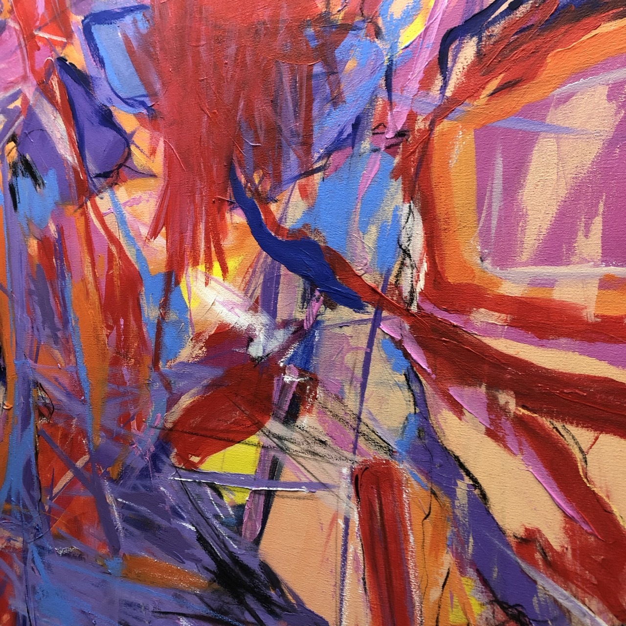 Close-up of an abstract, colourful painting.