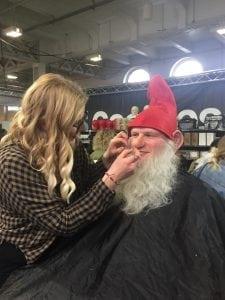 student creating a gnome with make-up