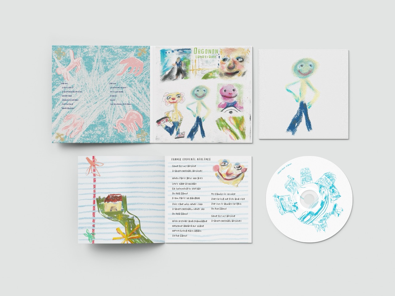 A set of illustrated notebook pages and loose drawings displayed on a light grey surface, including colourful abstract sketches, a handwritten page and a circular drawing on paper.