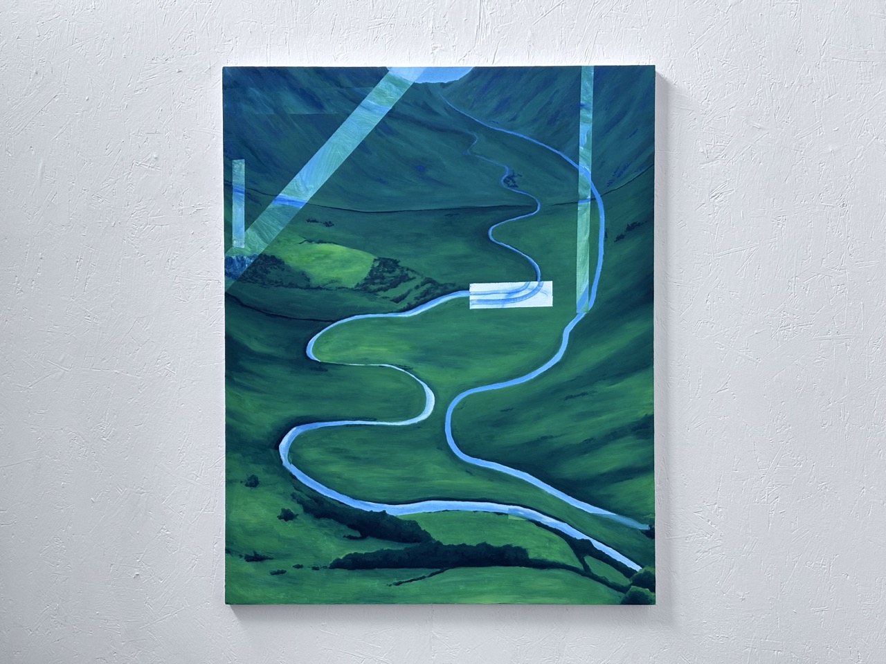 An abstract landscape painting depicting a winding river flowing through lush green hills. The artwork features geometric shapes in blue tones, contrasting with the vibrant greenery of the hillside.