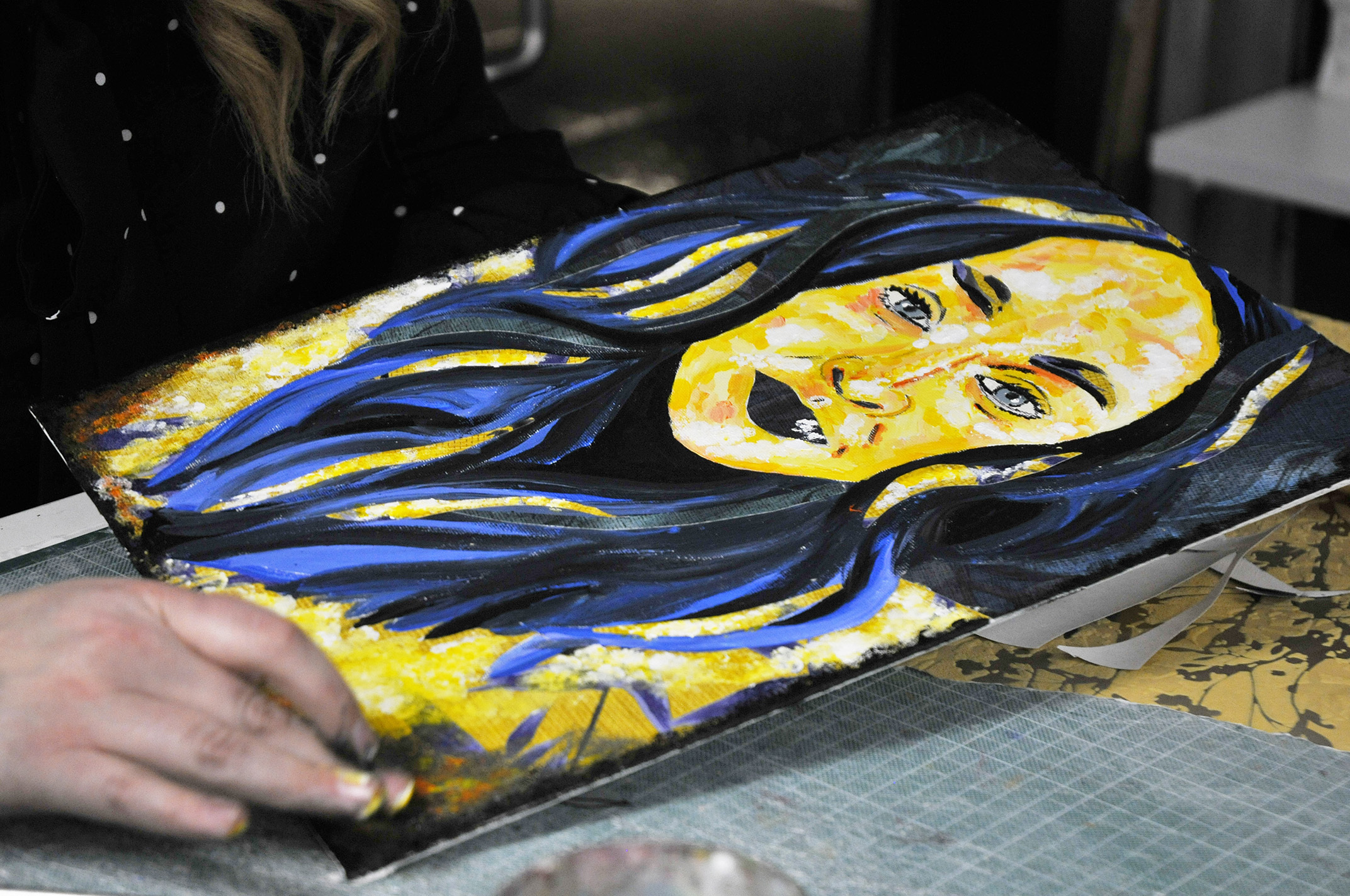 A painted portrait of a person. They have long sweeping hair and a smiling face.
