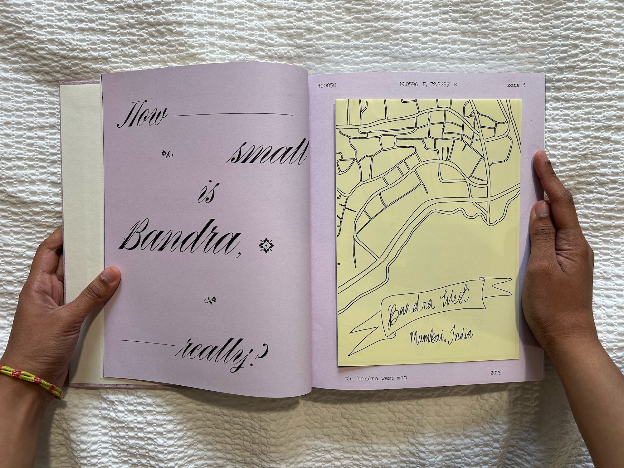 A double-page spread from the interactive publication "Nana's House" by D Saldanha. The pages are lilac in colour; the left page shows text reading "How small is Bandra really?". The right page shows a map on yellow paper.