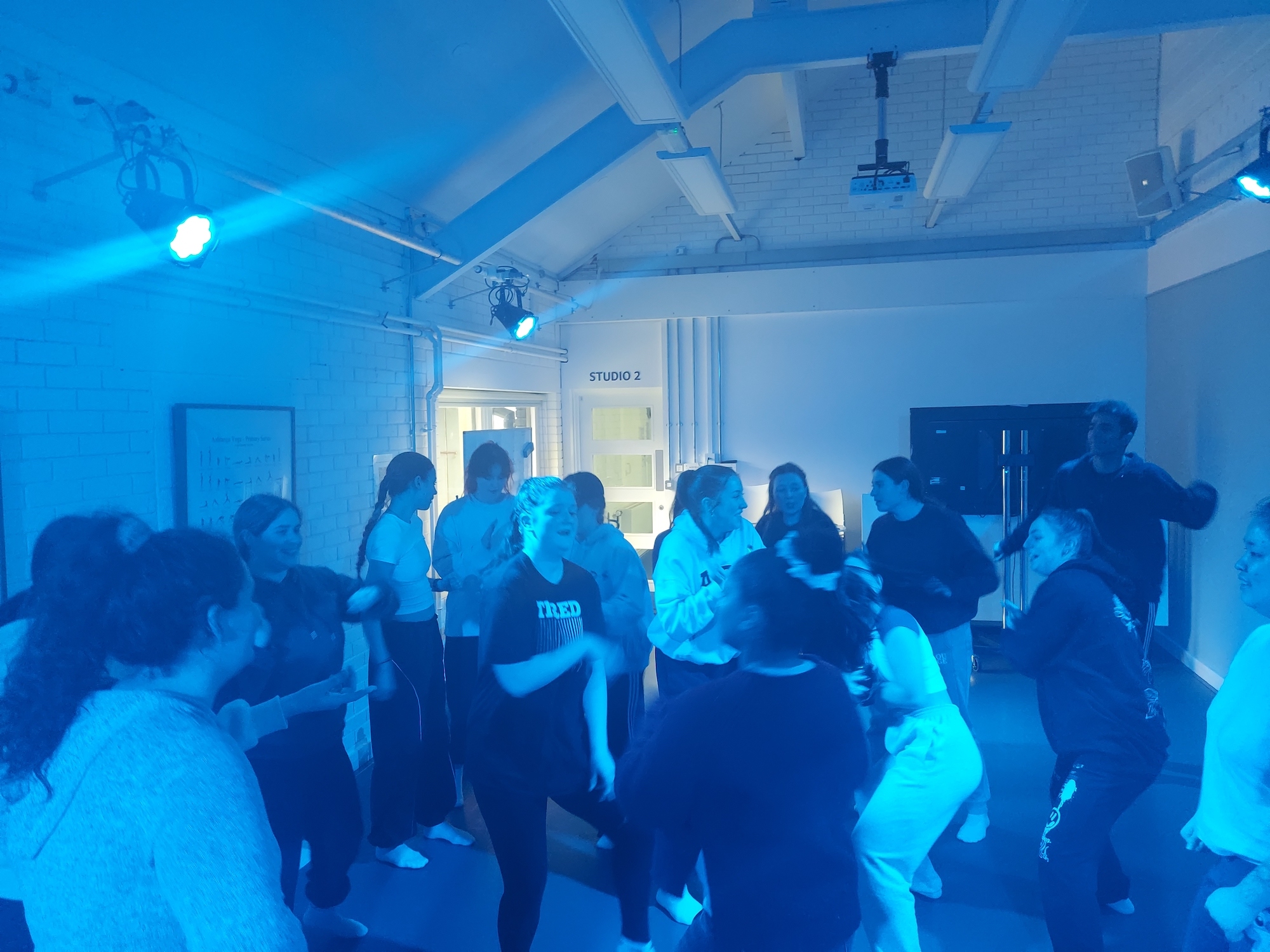 A large group of BA (Hons) Dance students dancing in one of the AUB dance studios.
