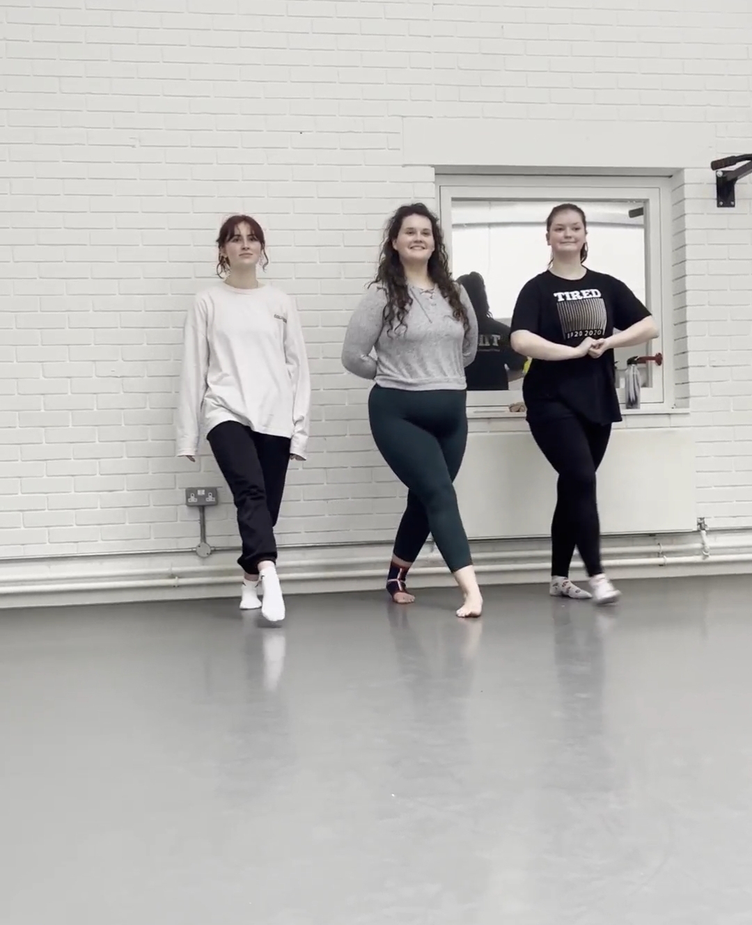 Three BA (Hons) Dance students rehearsing in one of AUB's dance studios.
