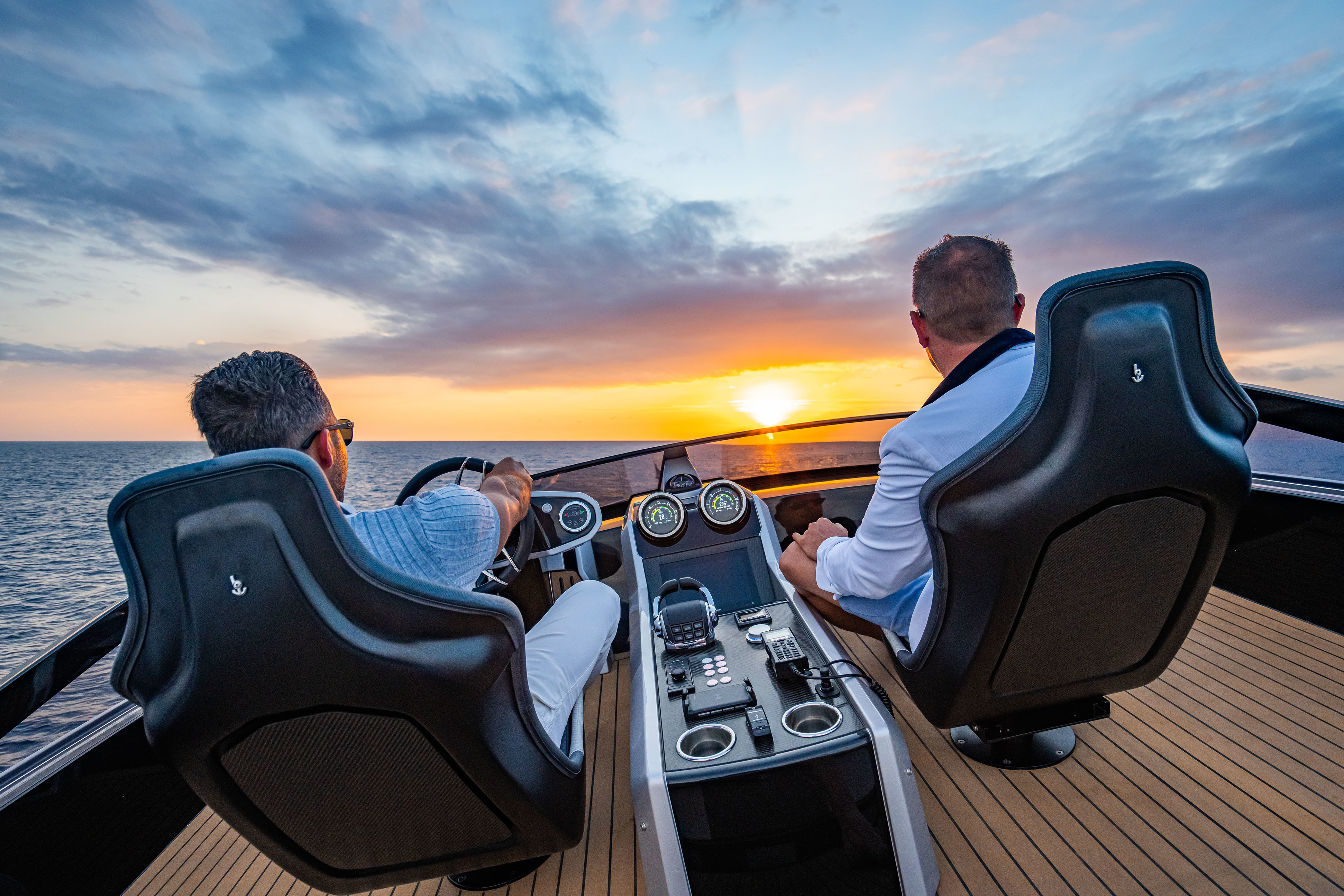 Two people operating Sunseeker speedboat