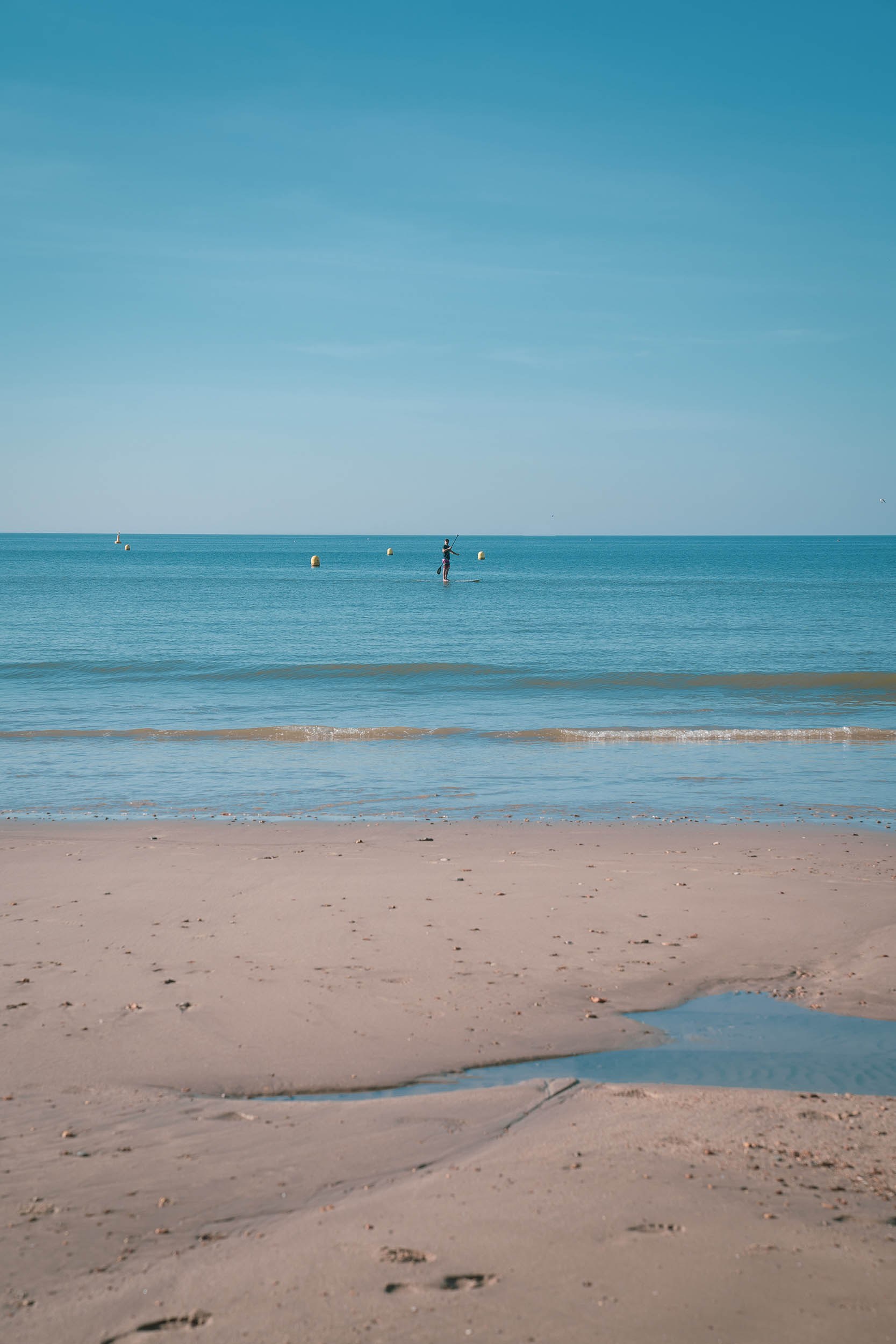 Stand up paddle boarder in the sea