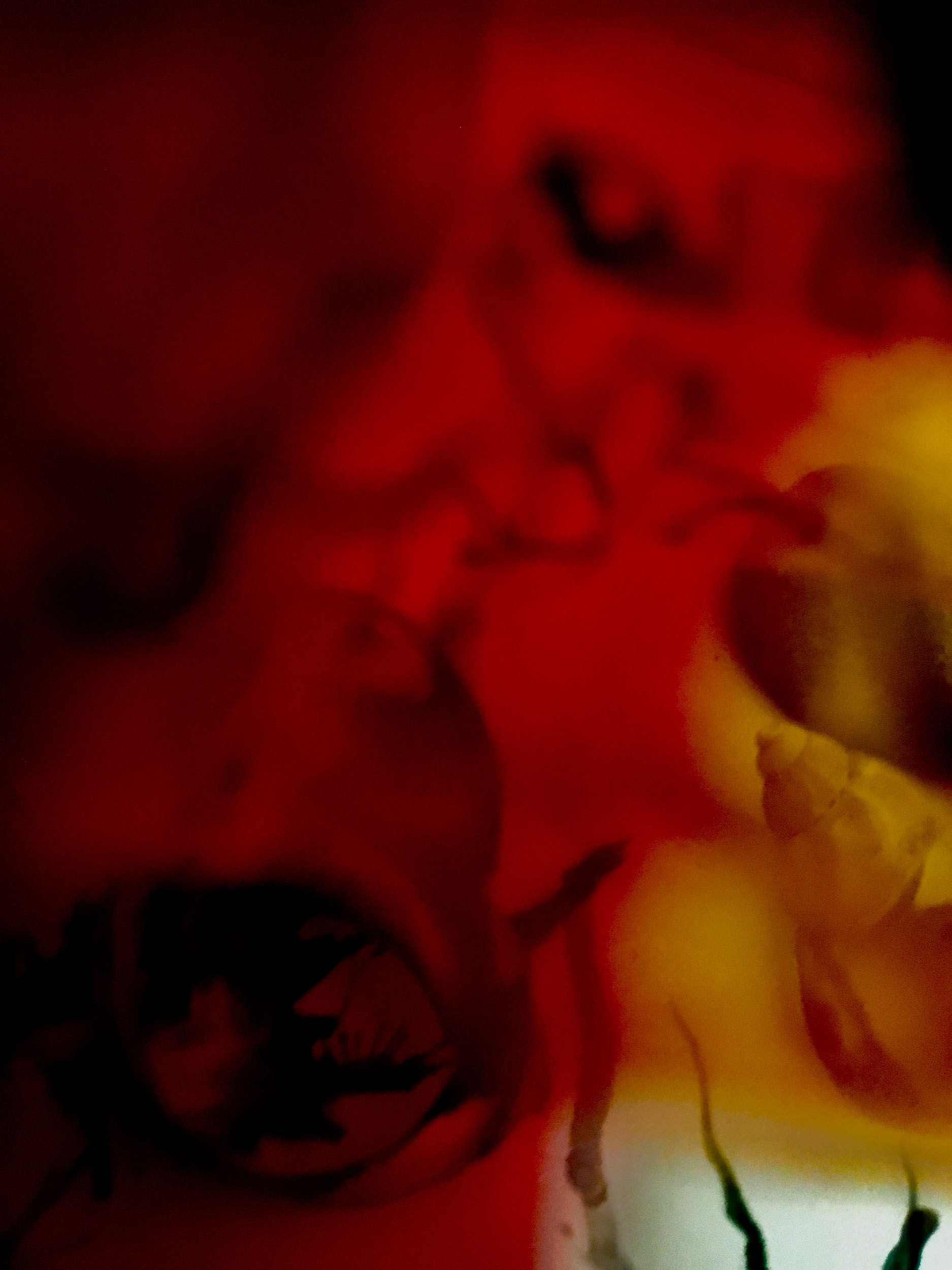 An image with red liquid like shapes spreading across