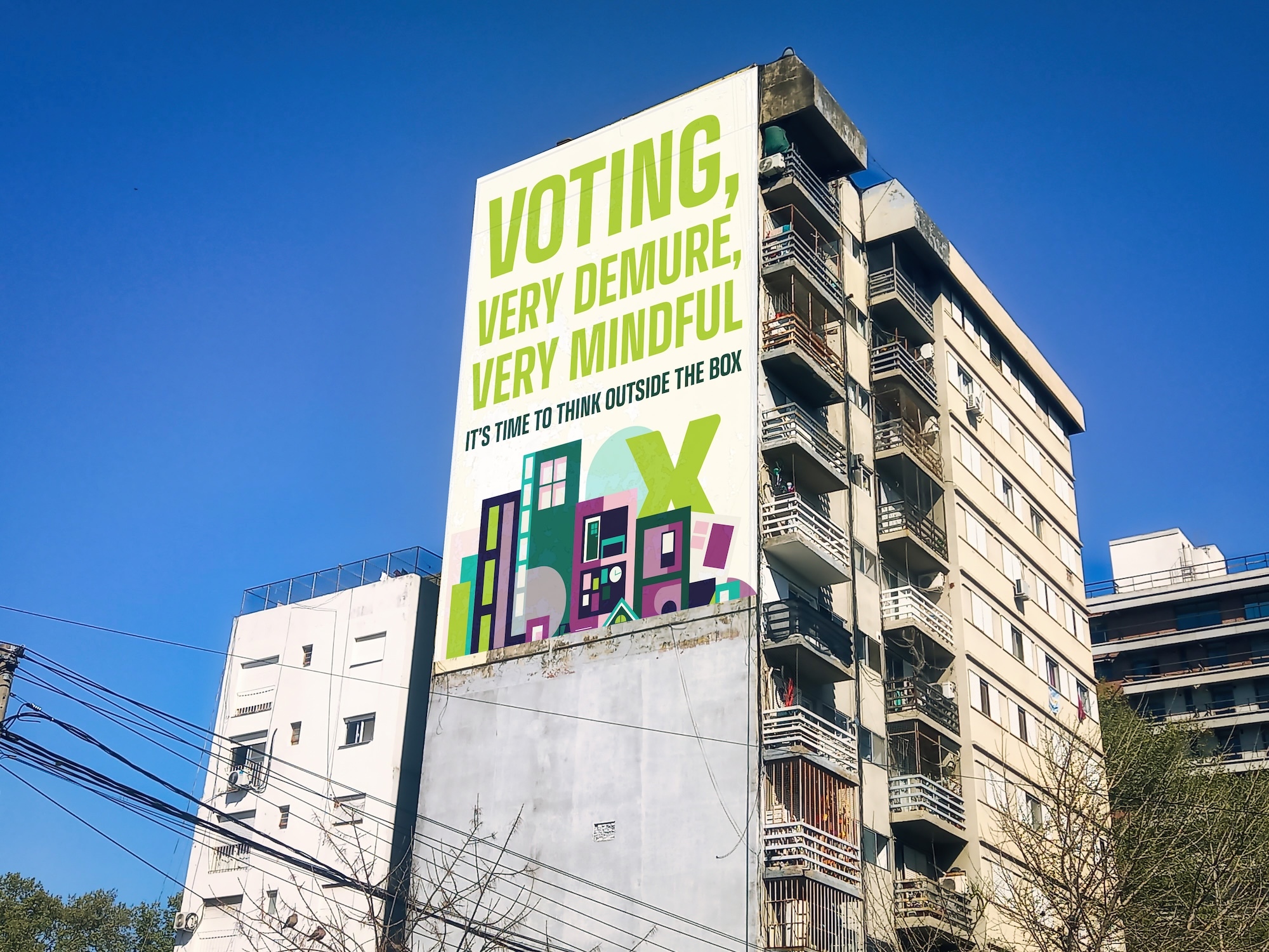 Large voting campaign billboard on apartment building featuring green text and colourful geometric shapes against blue sky.