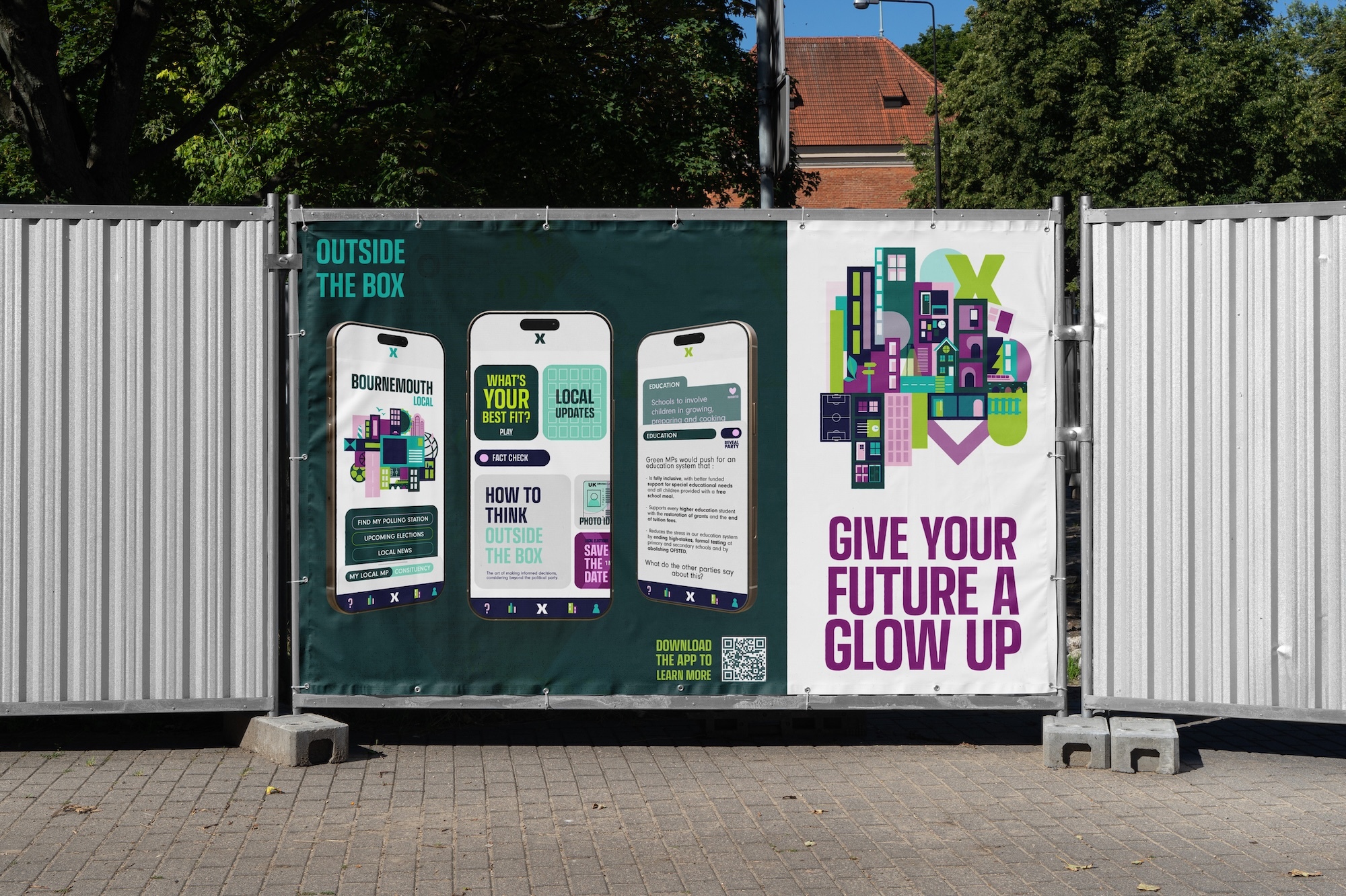 Green information board with white panels and purple text reading "GIVE YOUR FUTURE A GLOW UP" mounted on corrugated metal fence.