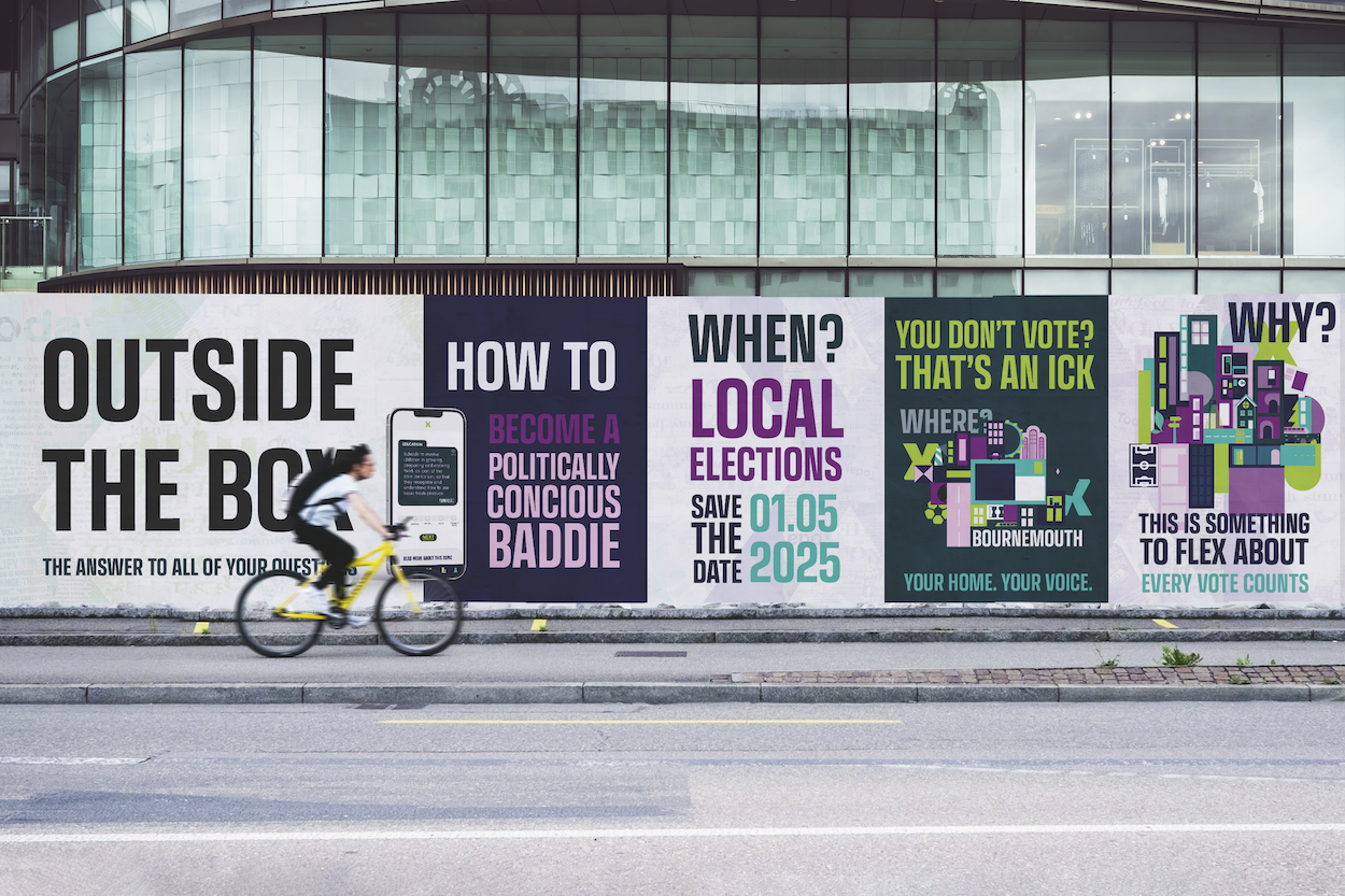 Large advertising hoarding on building facade displaying voting campaign posters in black, white, purple and green colours.