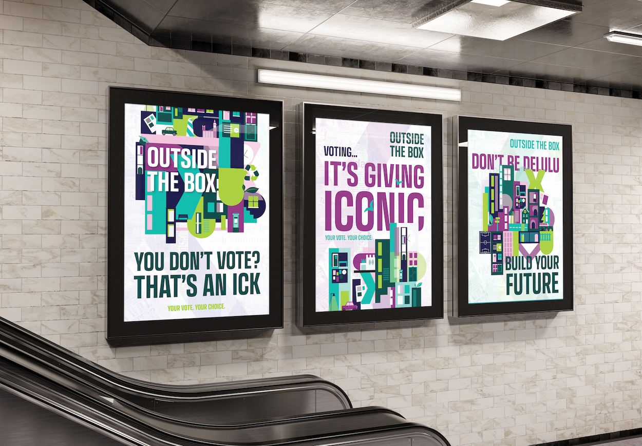Three framed posters on white tiled wall above escalator. Colourful geometric designs with text about voting and civic engagement.