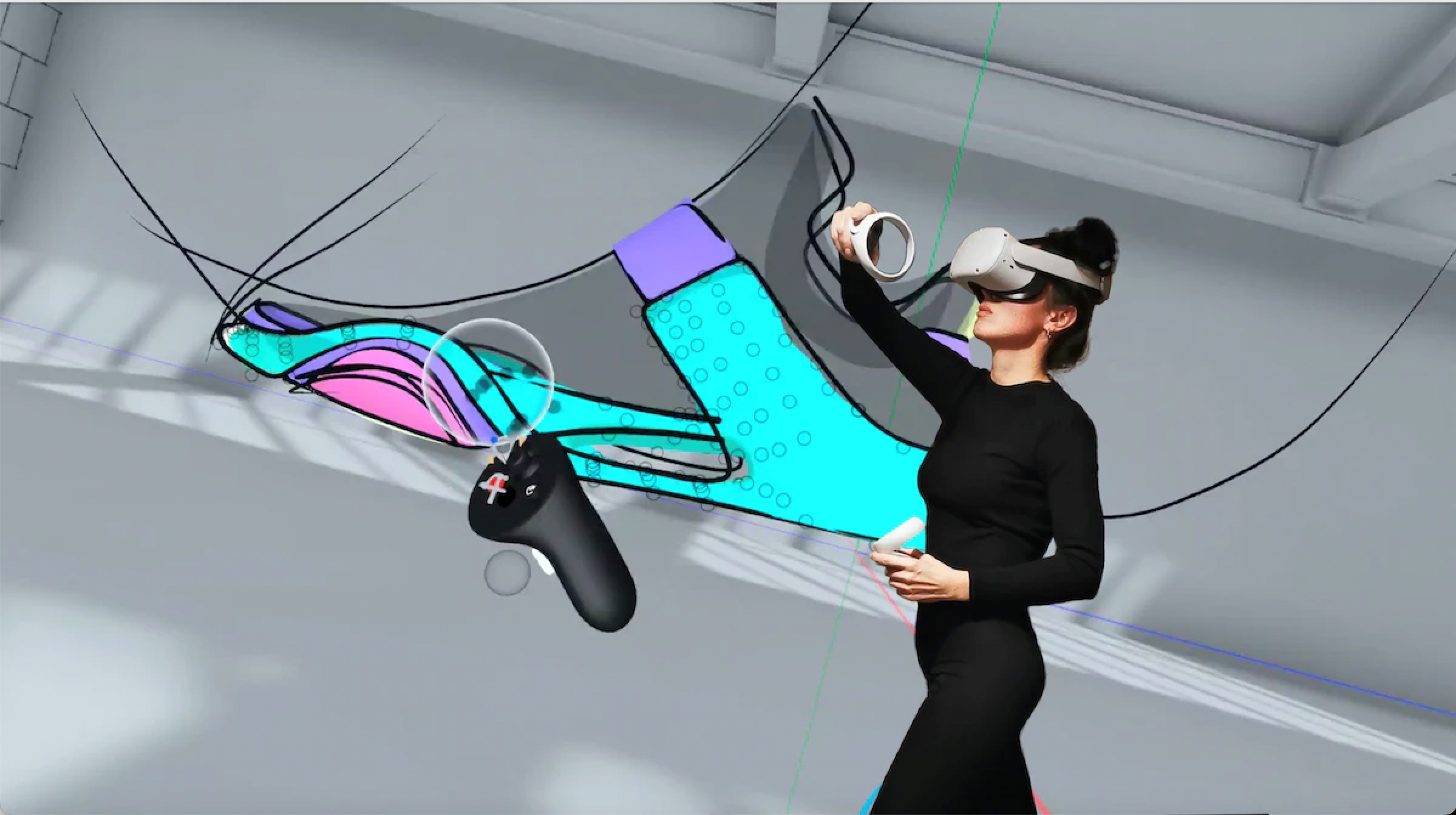 A person is using VR equipment to draw abstract colourful shapes and lines.