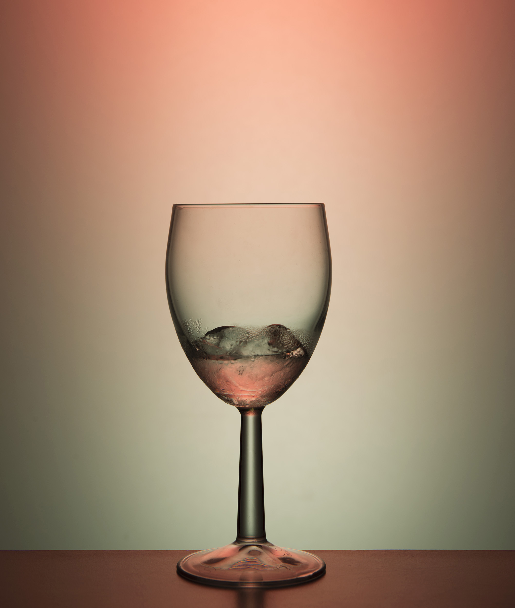 A wine glass with ice in it